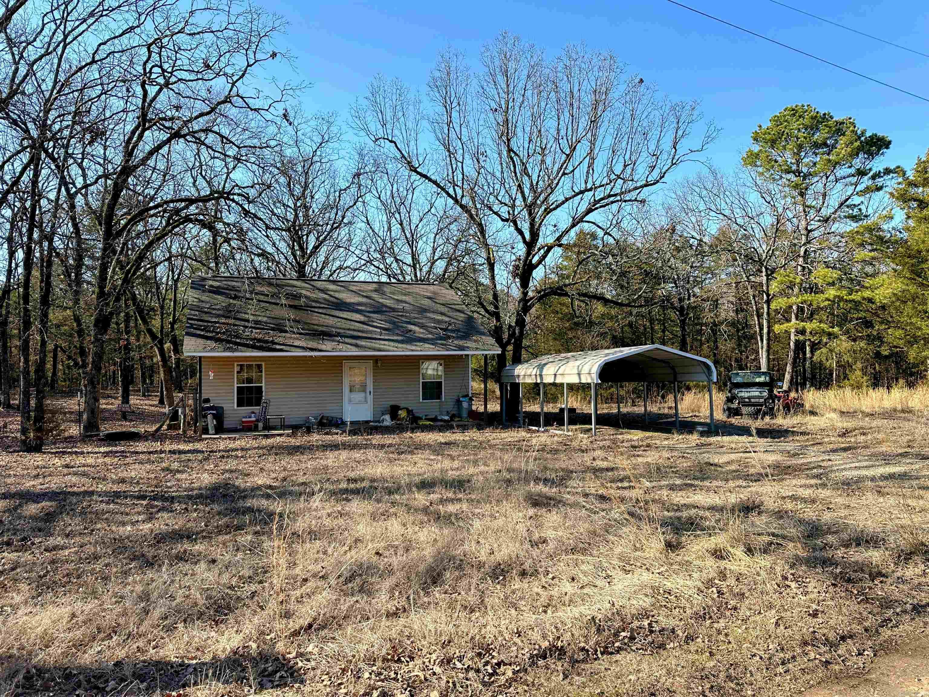 Tucked away at the end of the road, this adorable 2-bedroom, 1-bath home offers the perfect blend of privacy and potential. With over 5 acres to enjoy, there's plenty of space for outdoor activities, gardening, or even expanding. A little fresh paint, new flooring, and your personal touch will make this home shine! Whether you're looking for a peaceful getaway or a place to put down roots, this property is a fantastic opportunity to create your own countryside haven. Don't miss out, come see the possibilities!