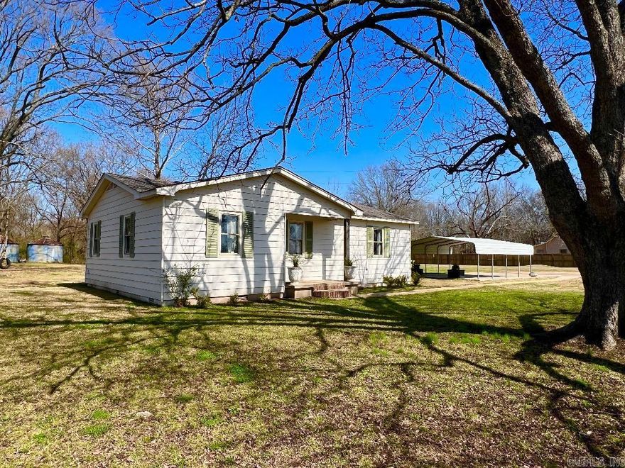 Perfect starter home on THREE ACRES with water view! This rural property has been lovingly restored and sits on 3 acres with bayou access. The lot has huge pecan trees that produce up to 25 lbs of pecans each year! With original harwood floors and tons of natural light streaming through the windows, this home feels spacious and bright. Three bedrooms and a bathroom make up the east side of the home with the large den, kitchen and laundry on the other side. Enjoy entertaining down by the water as it has been cleared to the shoreline. One can easily launch their fishing boat. The two grain bins serve as unique storage for all you lawn tools or holiday decor. With new insulation, new HVAC, new roof, new lighting, new appliances, new plumbing, new tile, paint and a COMPLETELY brand new bathroom.... This home is a must see!  *call us or your favorite realtor to see! *pre approval required for showing