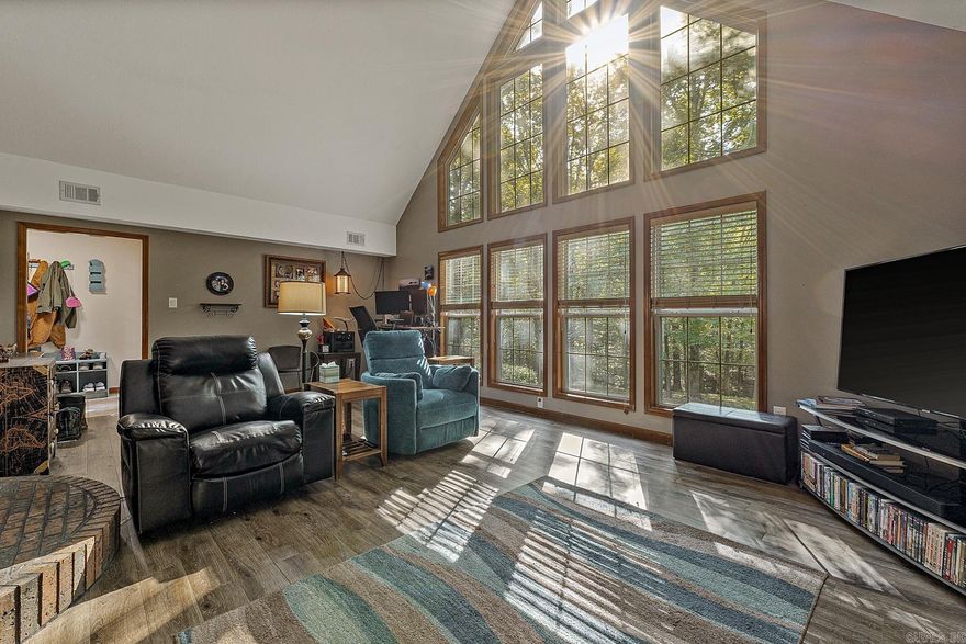 Welcome to this beautiful, custom built home on Crowley’s Ridge. Just minutes from Harrisburg and Lake Poinsett State Park, where hiking, fishing, boating, and camping awaits. This is the perfect home for those who seek nature and privacy but need to commute to Jonesboro or Memphis. The home features a 3/2 split floorplan on 6.14 mostly wooded acres. The home also features a vaulted ceiling in the living area, great for natural light, and enjoying the beautiful valley below. Along with the vaulted ceiling, the living room has a brick fireplace, with gas log. Step out on the back deck to enjoy more nature or relax under the gazebo and enjoy the garden pond. The master bedroom comes with a master bath and walk-in closet. The other side of the house has two guest bedrooms with a full bath. The loft could be used as an office/game or another guest room. The home features many recent upgrades including new architectural roof (2023), new oversized HVAC system (2023), all fixtures updated to modern aesthetics, new paint, fiber internet, generator disconnect at breaker panel, and underground utilities. Garage is heated and cooled, also included in square footage.