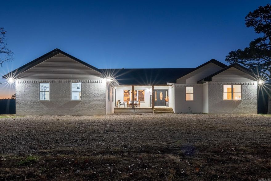 Experience luxury riverfront living at its finest in this sprawling 55-acre estate nestled in Mt. Ida.  This exquisite property boasts a spacious 7-bedroom, 4.5-bedroom main residence featuring 2 living areas, perfect for entertaining guests or enjoying family gatherings.  Additionally, the onsite 1,800 sq ft barndominium offers 4 bedrooms, 2 baths and a living area, providing ample space for extended family or as a lucrative short-term rental opportunity.  With nearly 3/4 mile of gated river frontage along the Ouachita River, enjoy ample hunting, fishing, kayaking, canoeing and swimming along with unparalleled privacy and serenity amidst breathtaking natural beauty.  Furnished with upscale amenities, this property offers a seamless blend of comfort and elegance, creating the ultimate retreat for those seeking luxury riverfront living.