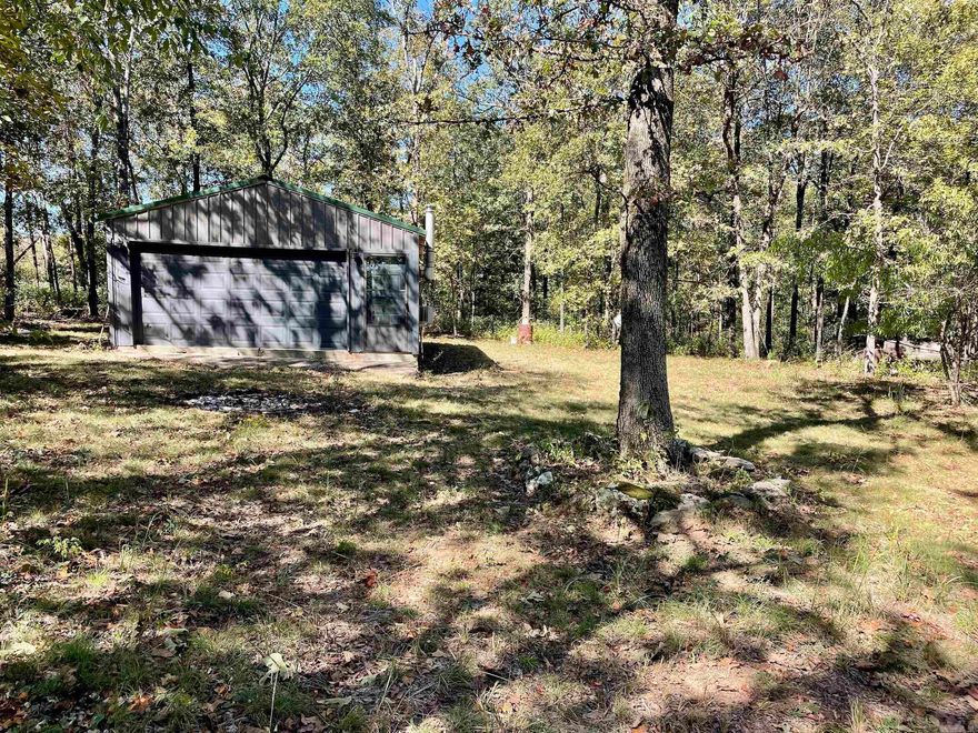 This is the kind of property everyone is looking for and just in time for this hunting season! The 1800 square foot cabin sits behind a locked gate at a private entrance and has heat and air with a wood-burning stove, shower, flushing toilet and a small kitchen with one bed and plenty of room for additional beds. The metal-sided cabin also has an overhead door so you can store your ATV inside while you are away. All you need to do to be able to enjoy this property right away is cut some wood for the stove and bring your gear! There is an ATV trail that winds its way across terrain that is rolling and gently sloping with large red oaks and white oaks. The bordering property has been heavily timbered and has created a haven for deer, bear and turkey. The entrance and cabin are situated on the edge of the property which leaves most of the property undisturbed for the wildlife to enjoy. Mineral rights owned by the seller may be negotiable.