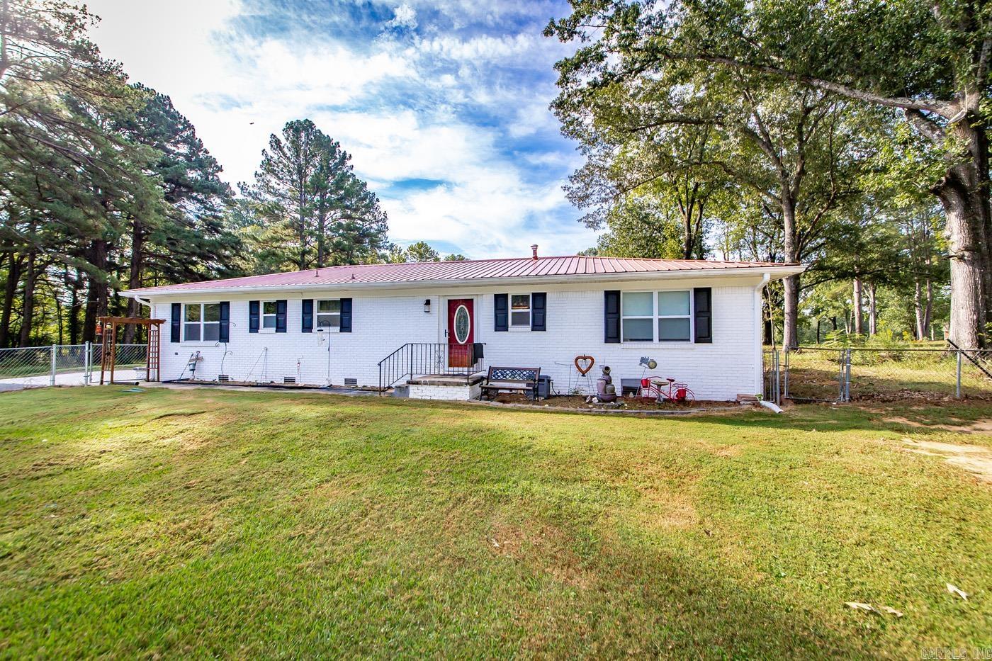 Looking for land and to live just outside the city limits but close to town, close to I-67/57 & LRAFB. This remodeled Kitchen will amaze & delight! Metal roof, new flooring, new paint, 2 stunning bathrooms and 2 bedrooms. Would make a great first time home buyer, AIRBNB for the Wedding Venue across the street! There is an unfinished tiny home on the property that you can put your personal touches on and have investment property and live in the main house! So many options! *sq ft approx, plz measure. The acreage is 3.3 +/- survey recommended