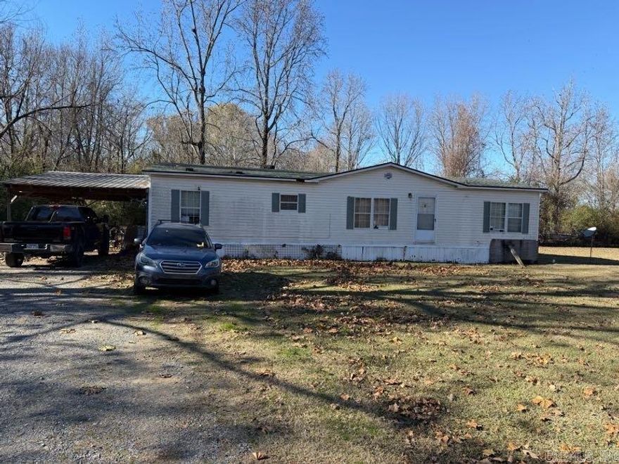 Quiet country living in Lonoke! 3 bedroom/2 bath manufactured home on roughly 2 acres (acreage determined by parcel boundary measurements found on county records). Washer, dryer, fridge, stove, security cameras, grills, gun safe, shed, trampoline, swing set and space heaters do not convey. Seller is offering a $500 credit toward a new stove! Property is being sold as-is. No seller property disclosure.