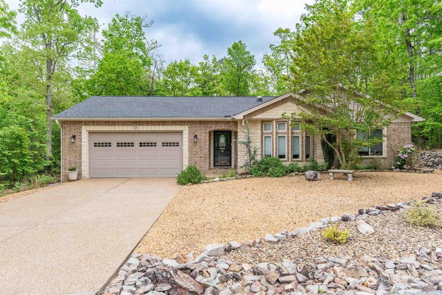 Great curb appeal in this east end beautifully maintained three-bedroom, two-bath home blending modern style with subtle Southwest design and rustic elements.  This inviting residence sits on a level, wooded lot directly across from the scenic Ponce Golf Course.  Inside the home you'll find an open layout with well-appointed living spaces, kitchen with soft close cabinetry; beverage cooler; vaulted ceilings, workspace off of the living room with cabinets, separate laundry room, and sitting room off of the primary bedroom.  Car enthusiasts, hobbyists, or anyone needing extra storage will appreciate the oversized, extended two-car garage with large workshop area/golf cart bay, complete with a second rear door for easy backyard access.  Outdoors, the property shines with a beautifully landscaped yard, mature trees, and peaceful wooding surroundings and covered back patio. Roof and gutters replaced in 2023.  Refrigerator, Washer and Dryer convey with the purchase.  See Agent Remarks for further details and Documents for Floor Plan and list of Seller Updates.  Come see all that this