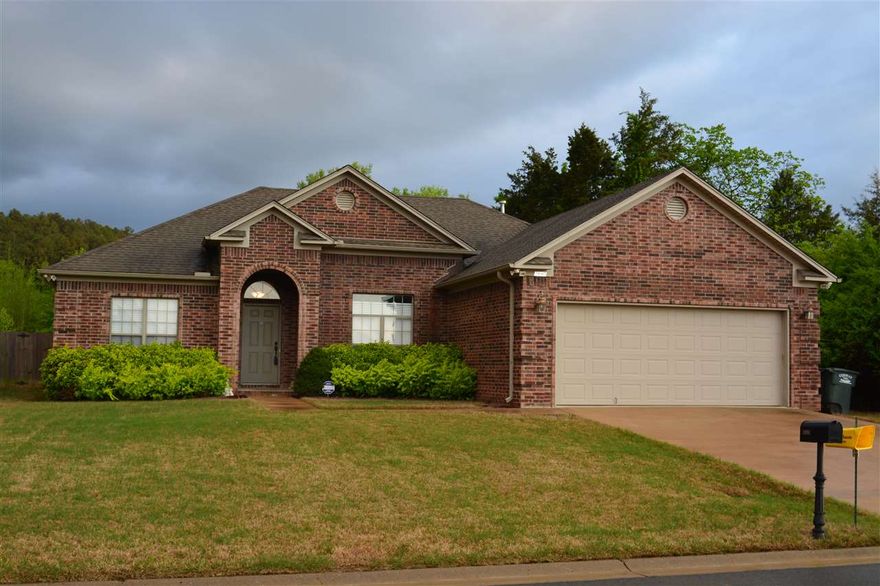 Don't let this one get away! Nice 3BR/2BA split floor plan with a formal dining room with french doors that could be used for an office. Master bath has jet tub and standup shower, Laminate Hardwood floors in living rm. Tile backsplash in kitchen, Refrigerator conveys, Storm shelter in garage that can go or stay.  Lot backs up to the woods. Motivated seller!