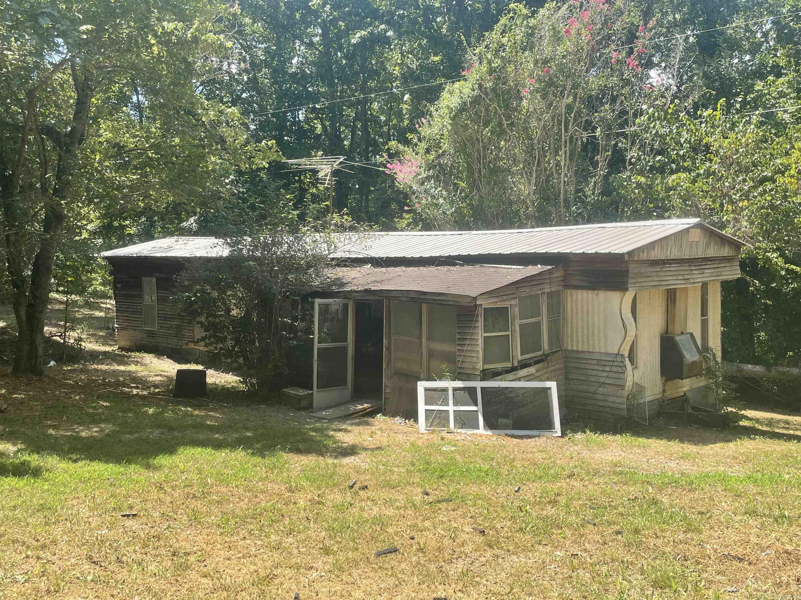 Handy man special!!! 1.12 acres with power, water and septic with an old mobile home on it that need some work. This would make a nice hunting camp as the property is located close to the National Forest.