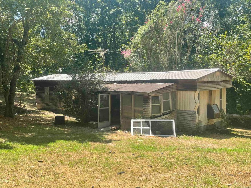 Handy man special!!! 1.12 acres with power, water and septic with an old mobile home on it that need some work. This would make a nice hunting camp as the property is located close to the National Forest.