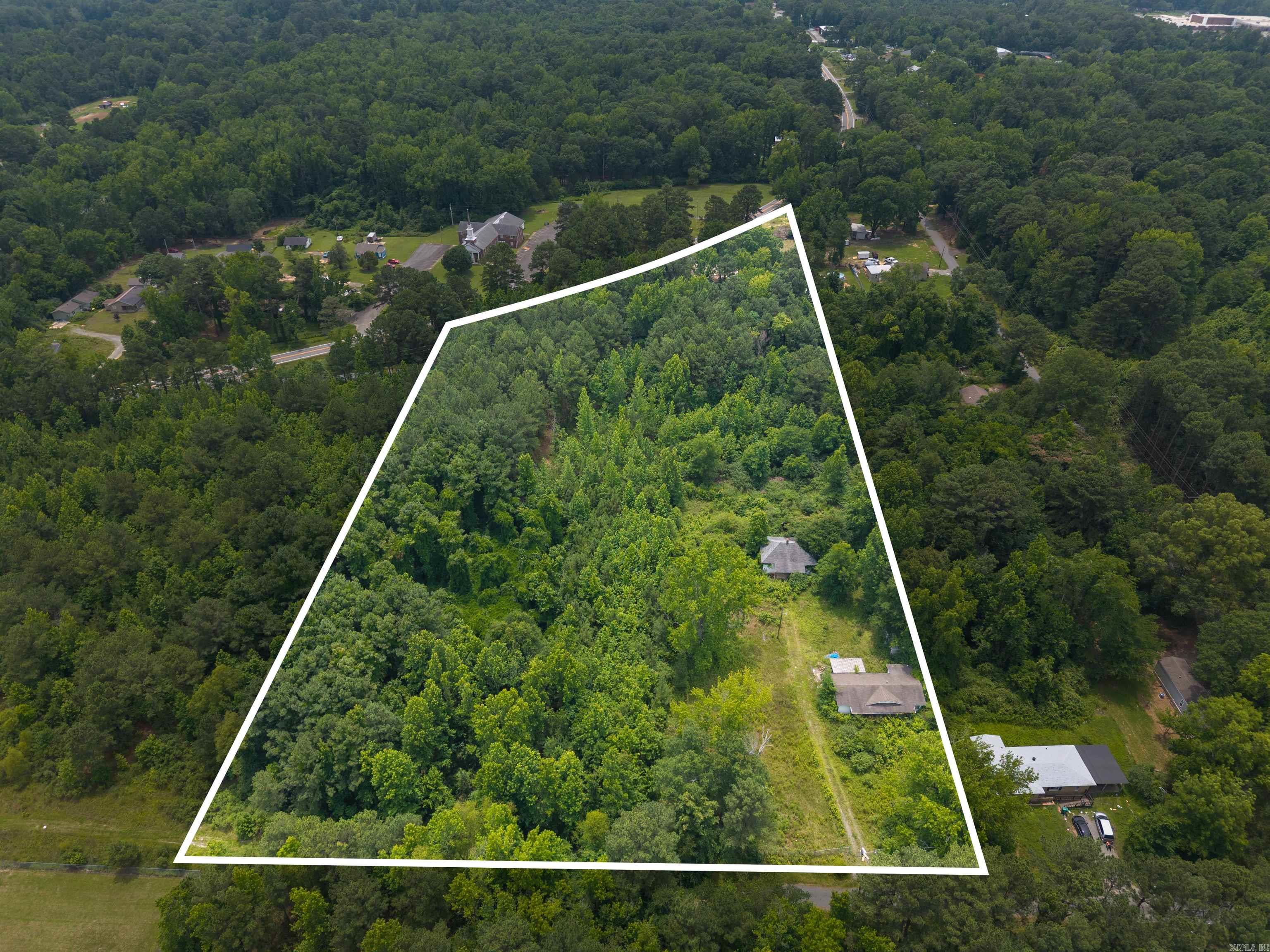 These TWO parcels of land are being sold together. Each has a structure on it, and each property is in unknown condition. These are being sold together, and have had utilities set up before, so utilities are available. You can easily build custom on this property or possibly use the previous footprint of the old houses to rebuild.