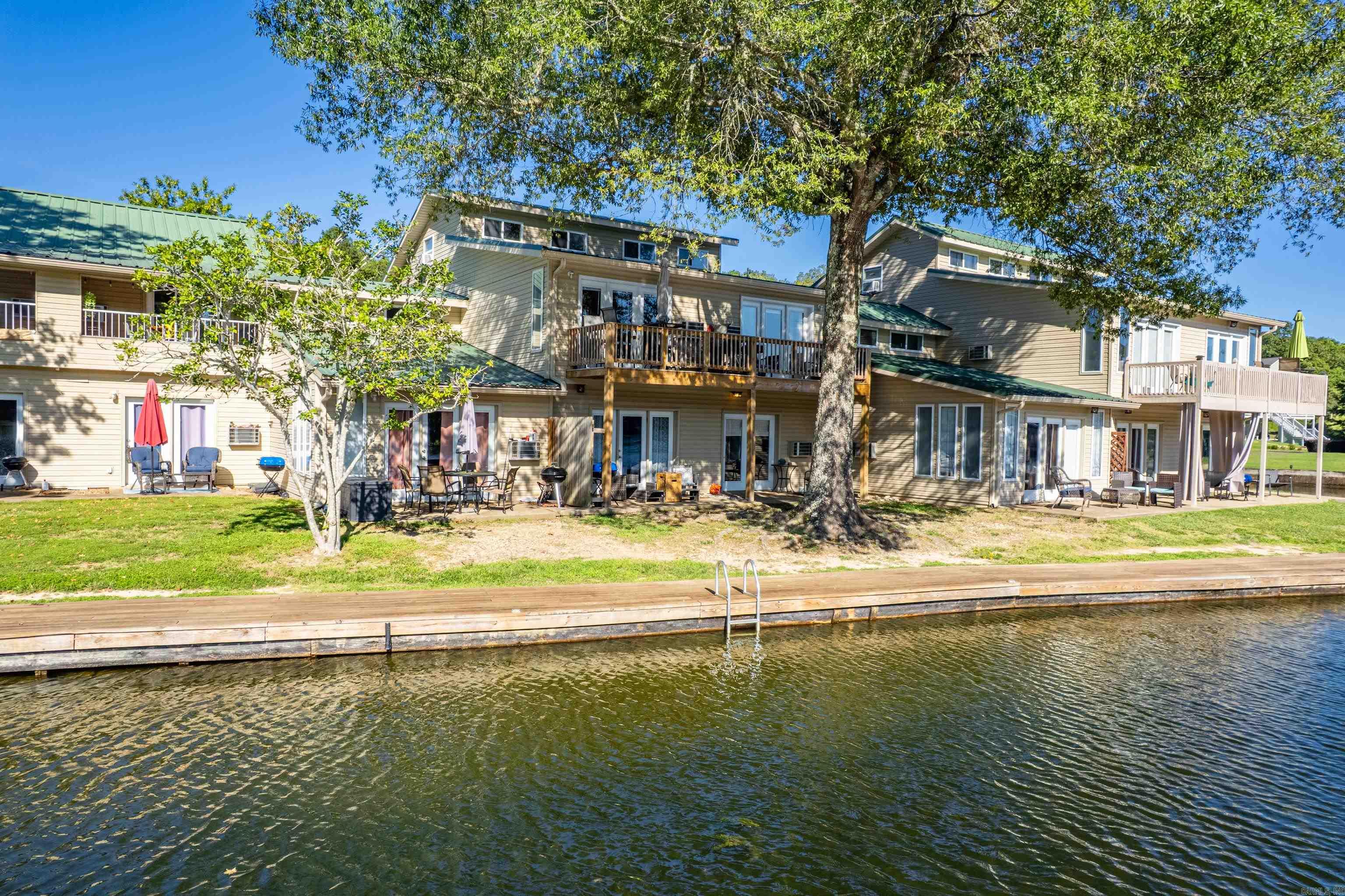 Lakefront Condo Right on the Water for Under $150,000 ā Adorably Decorated and Fully Furnished!!! Experience convenient ground level lakefront living at its best with this charming 1-bedroom, 1-bath condo just steps from the new boardwalk and the sparkling waters of Lake Hamilton. This ground-level, waterfront unit is the perfect place to relax, unwind, and soak in the view. Beautifully decorated and sold fully furnished, the condo has been thoughtfully designed to feel both cozy and stylishāideal for a weekend getaway, full-time residence, or a standout Airbnb investment. Best of all, itās not subject to Hot Springsā short-term rental ordinance, giving you the flexibility to rent when youāre not enjoying it yourself. Located in a well-maintained, gated community with strong Wi-Fi and just minutes from downtown Hot Springs, youāll have easy access to dining, shopping, and entertainment while still enjoying a peaceful retreat right on the water. This property is currently an active short-term rental, making it a turn-key investment opportunity and a rare find on Lake Hamilton. Seller is willing to negotiate this as a package deal with 2 other condos that are available.