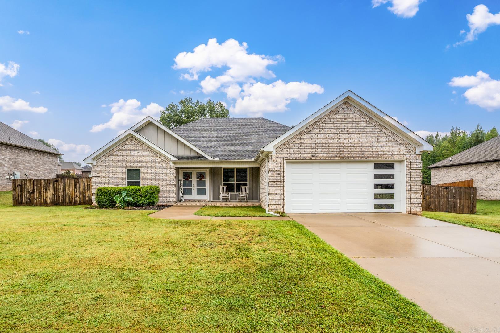 This like-new 2020 built home is in the highly sought after Shadow Creek subdivision, only minutes from schools, shopping, and 1-67! You are greeted by great curb appeal and modern finishes! The double front doors lead you into the large living room with TALL ceilings. Open and split floor plan with plenty of space! The kitchen has granite countertops, large wet bar island, black stainless steel appliances, and abundance of storage space. The master bedroom has tray ceilings, a large walk-in closet, and the sliding barn door leads you into the large master bathroom with his/her sinks, oversized soaking tub, and beautiful walk in shower with sitting bench! 3 other bedrooms are spacious with large closets. The covered back patio is perfect for entertaining. Fully fenced yard, outdoor storage building, and guttering! Come check this one out before it is too late!