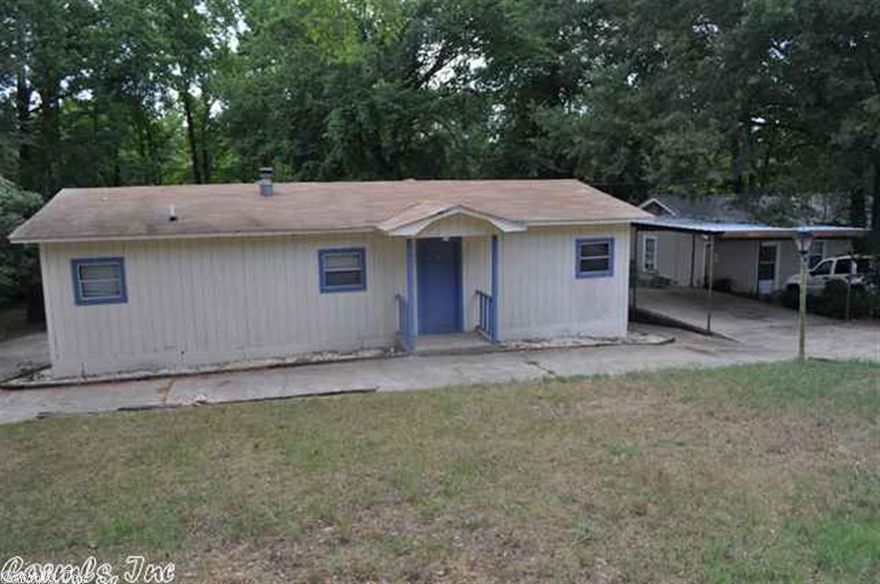 INVESTORS! Has previously rented for $500.00 a month. Great little cottage that has been updated, 2 new AC units, some decks & stairs, parquet  floors, gas log free standing stove, private pier to Lake Conway inlet, boat launch around the corner.  Lots of storage. Sits on 2 lots. Live on one lot build on the other. New septic.. Come see!