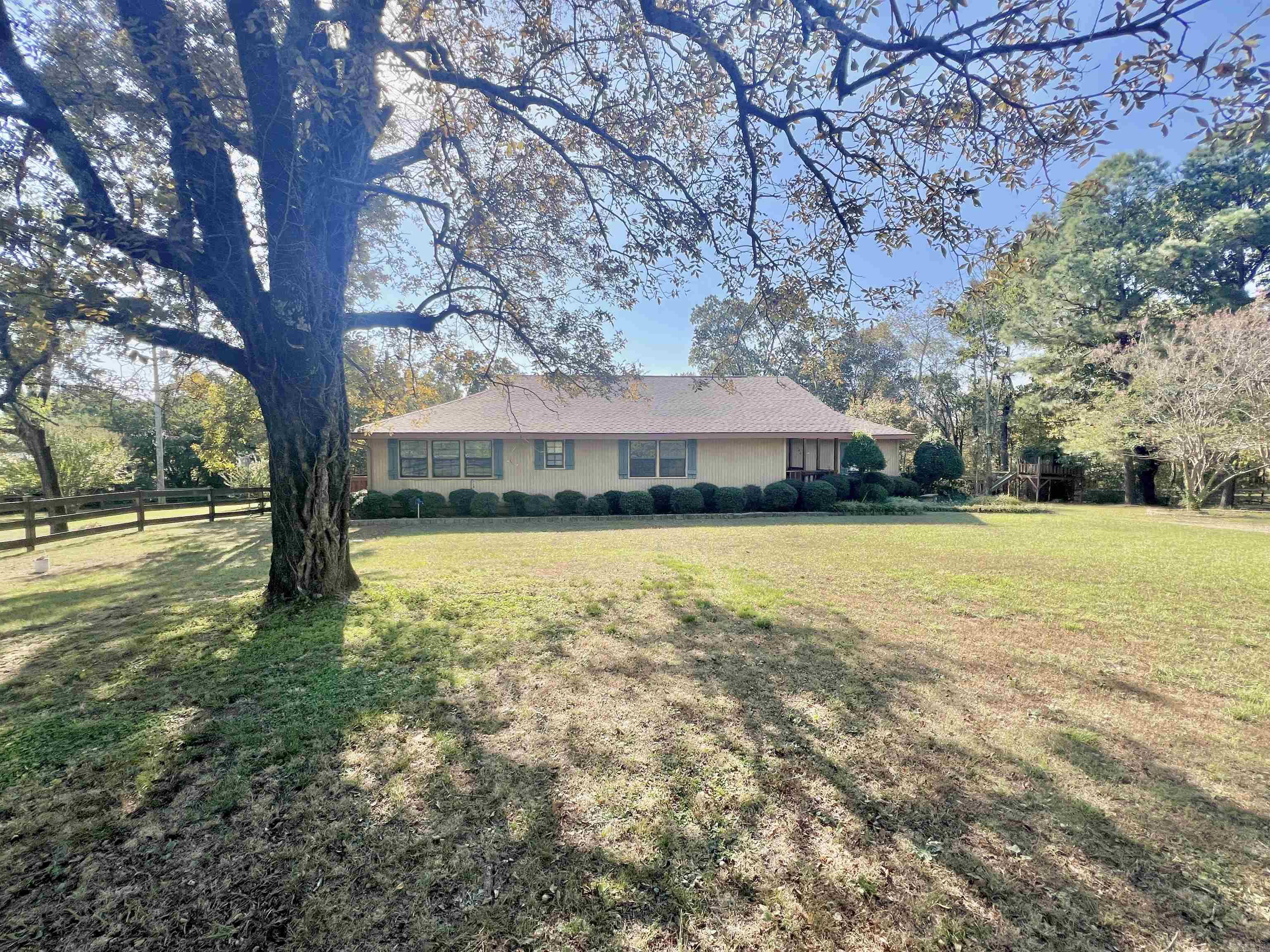 A country welcome is what you're going to get when you view this home. This serene property offers pasture and woods on 2 acres. Some of the updates include new roof 2023, new septic 2019, hvac 2020. Enjoy all the space you need inside and outside! All bedrooms are separated. The master bedroom has a walk-in closet with ensuite, just off the master is a great sized office with private deck access. The kitchen is large with plenty of counter space and cabinets.  Just off the kitchen is beautiful dining room with lots of natural sunlight! Don't miss the walk-in pantry! Just off the dining is the laundry and craft room! This home is not lacking in storage! Go through the French doors off the living room to find the den/family room. Relax on screened in back porch and enjoy all the beautiful flowers and wildlife!  The oversized 2 car garage is detached and makes for a great workshop as well!