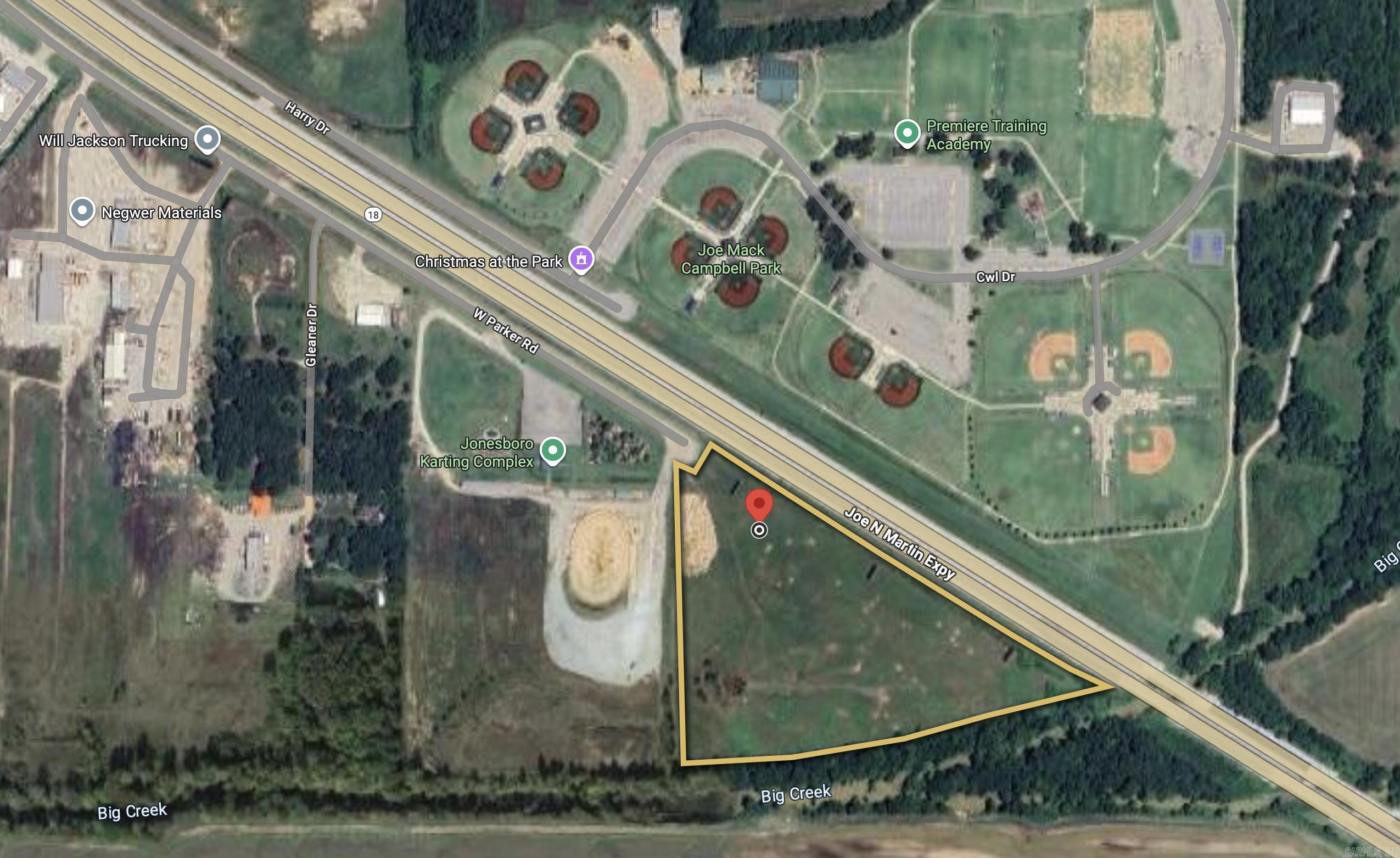 Prime development opportunity along Joe N. Martin Expressway (US-63/AR-18) in Jonesboro, AR. This 19.74-acre site is zoned C-3, making it ideal for a wide range of commercial and retail uses. Located adjacent to Joe Mack Campbell Park, the Jonesboro Karting Complex, and just minutes from major employers and residential neighborhoods, the property offers excellent visibility with an average daily traffic count of 22,000 vehicles. The site has convenient access via W. Parker Road, as well as proximity to Big Creek, providing natural drainage. Utilities, including electric & water are available nearby. With strong visibility, established zoning, and growing commercial activity in the area, this tract is well-positioned for retail, service, or mixed-use development.