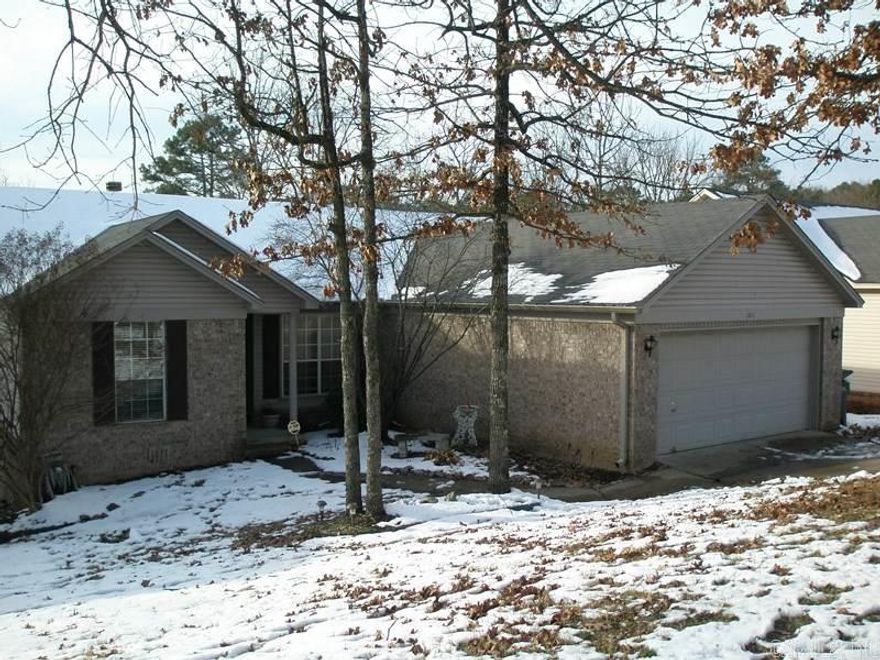 Great floor plan, loaded with updates, open and split floor plan, spacious kitchen, bar and eat-in area, new pulls, light fixtures, faucet, soap dispenser, backsplash. Pantry, utility closet, new laminate wood flooring, tile all wet areas. New fireplace mantle, new garage door motor with app remote control, upgraded shower heads, SS appliances, his/her closets, double vanity, spa tub, fenced with deck. New AC 2015.