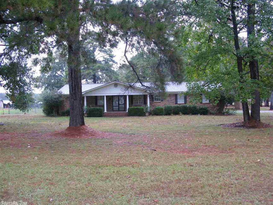 This 4 bedroom 2 bath home with approximately 3-1/2 acres is located about 3 miles from town.  it has a shop that is approximately 34x48.