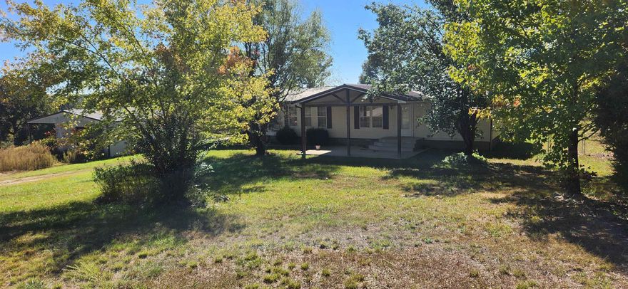 This country home in the Ozark foothills could be the home of your dreams! 3BR/2bath mobile home sits on 2.62 acres with three covered decks, carport, 30x24 sqft shop with 30x14 lean-to, 16x12 storm shelter, and it's near the South Fork Spring River! This is a great rural location on a nice paved road between Glencoe and Saddle in Fulton county. Come take a look before it is gone! Owner financing available with acceptable terms. Broker owned.