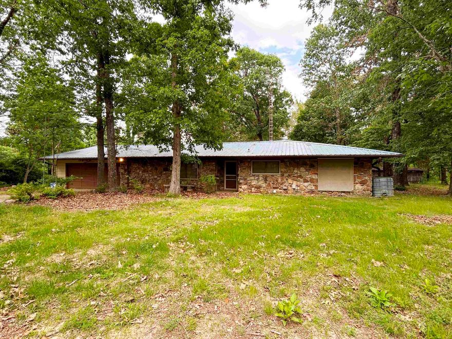 Look at this diamond in the rough! 38+ acres with a 2 BR 1.5 bath home with garage attached and a 30x50 shop with 2 overhead doors.  There are a couple more outbuidlings scattered around the property. Once was a gardener's dream, with lots of flower beds, fruit trees, garden spots that need revivied.  With a little TLC this would be a show place. Sitting on paved state highway is a definate plus.  Home is strategicly located down a long drive so is amost hidden from the road. Lots of large trees and timber on the property making it ripe for hunting and serenity. Minutes to Hardy, AR and Spring River.   Metal roof installed approx 2024, HVAC installed approx 2001, Just the second owner of the property, Shop has 2 over head doors approx 12 ft high, Storm shelter