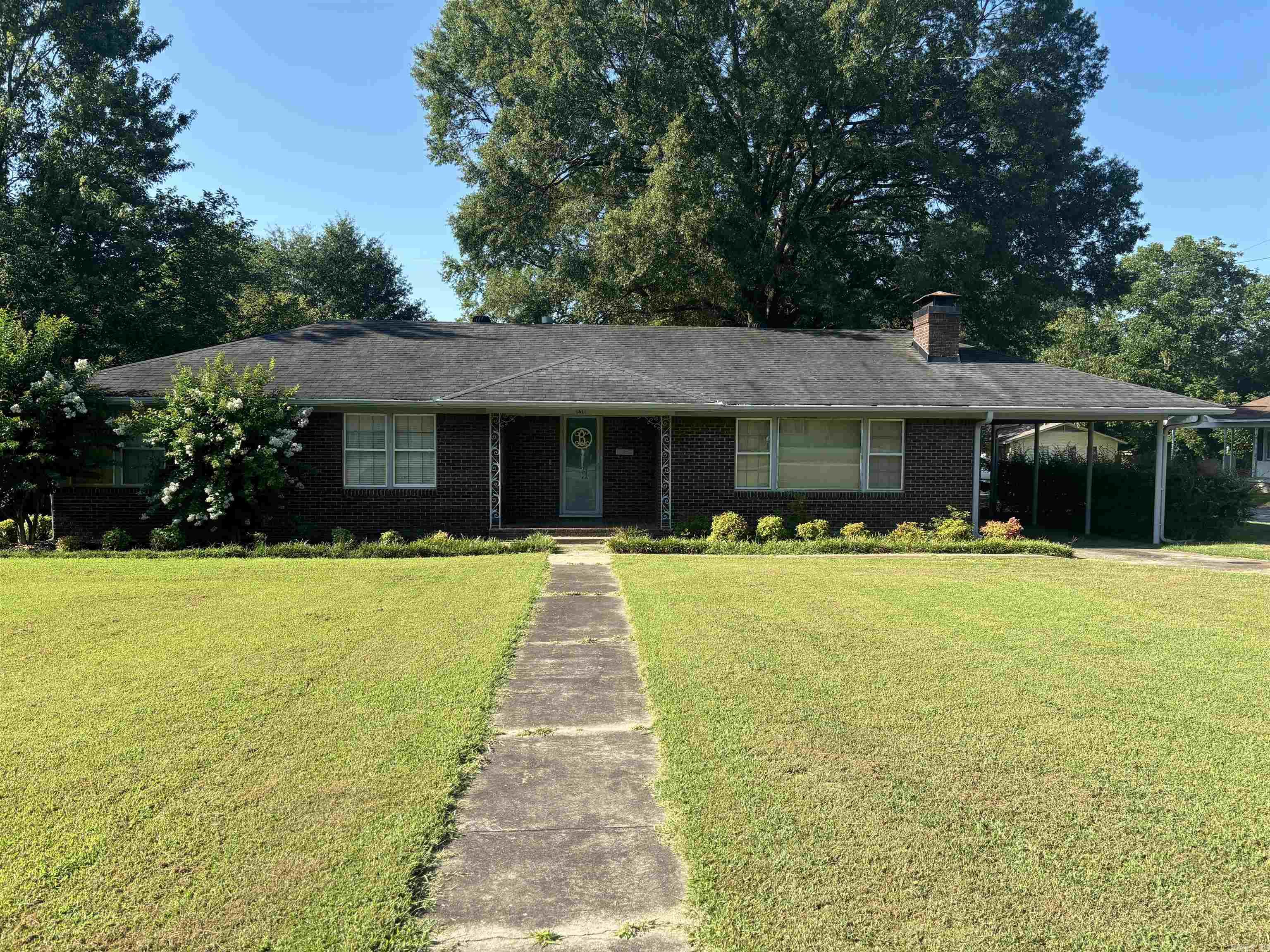 Nestled on a large corner lot, this mid-century modern brick home located on historic W. Arch offers original wood flooring and the perfect blend of classic design and contemporary updates. Located near all schools in Searcy with 3 bedrooms and 2.5 baths, this residence is ideal for families, Airbnb enthusiasts, or anyone who appreciates the elegance of vintage real estate. The drive-through carport adds more charm. Updates include a new roof in 2016 and HVAC in 2022. Enjoy the coziness of a wood burning insert in the fireplace. There is MORE! A shed and two RV hook-ups with concrete pads in the fenced back yard are perfect for housing extra guests. Experience the convenience of a newly added laundry room and various updates seamlessly integrated into the homeās original charm. Make your appointment today. This one won't last! See agent remarks for more information.