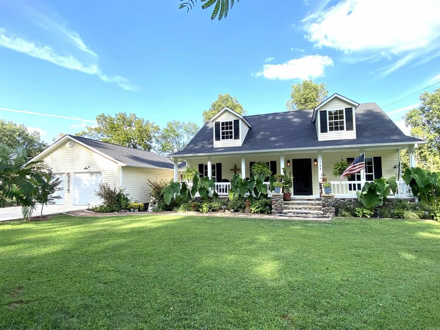 RARE FIND with a dock on the river!!! Stunning Riverfront Property with House and Cabin.  Nestled along the banks of the White River, this enchanting riverfront property offers a unique blend of natural beauty, modern comfort and rustic charm.  With spacious main house and a cozy cabin, this property provides the perfect retreat for those seeking tranquility and serenity.   Elegant 3BR/2BA home with top-of-the-line appliances and newly remodeled master bath.  Charming cabin offers a cozy retreat for guests or a private space for yourself.  Complete with bathroom, living area and small kitchenette. The rustic ambiance is perfect for experiencing the true essence of mountain living.  Easy access to the river for fishing, kayaking or enjoying the flow of the water.    New roofs, new rock steps and rock around the house and newly painted cabin. Included in Square footage total is Oversized garage (800SF) and Cabin (400SF) all Heated & Cooled.  Great investment opportunity for renting out the cabin.  2 separate septic tanks.  Sits on 2 riverfront lots.