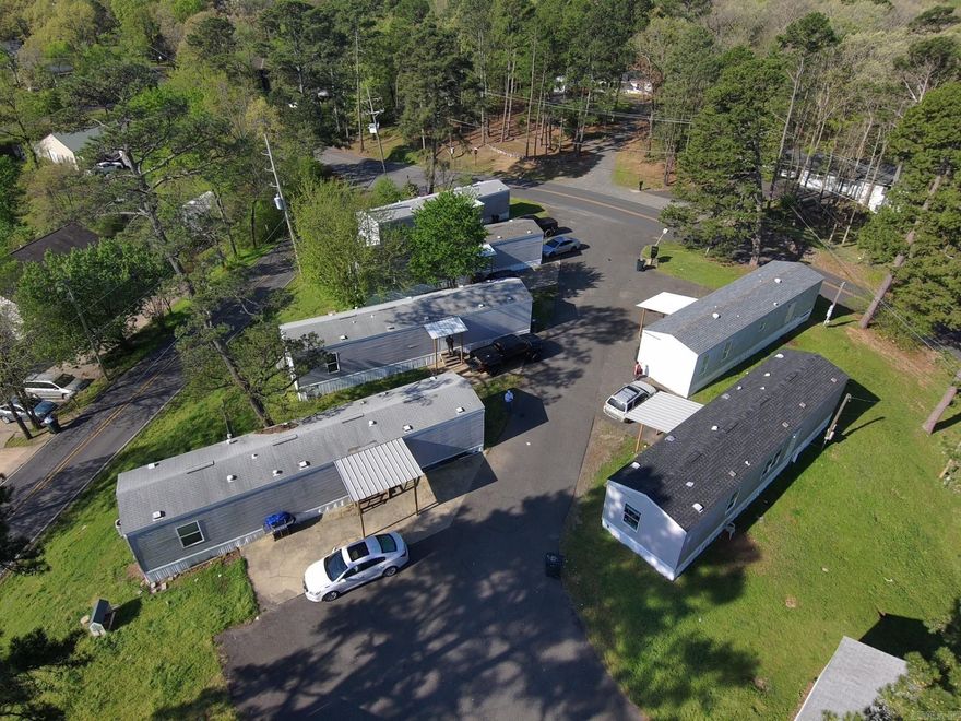Mobile Home Park for sale, 2 blocks from Walmart, just minutes from the lake. This would make a great investment for your portfolio, 16 units on site year models are 2005 and newer. rent was ranging from $ 855 up to $1100 on occupied units at this time.   Great neighborhood to invest in.  TONS of potential with this Park!   Drive by and take a look at the park and the neighborhood and see if this is something for you!  Would make great AIR B&B or replace with all new units and watch the value explode.  Units need repairs, some units need little done some need more.  Park sold as -is.  Make this property your dream at a great price.  ****AGENTS PLEASE SEE REMARKS FOR INFO. ****