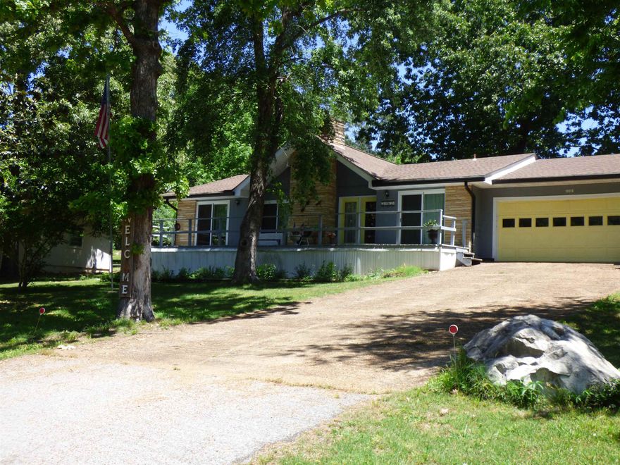 Surrounded by mature trees and just minutes from Crown Lake this home is the perfect place to relax and enjoy the outdoors. Step through the front door to a spacious open living & dining area featuring high ceilings and an inviting layout. The  primary bedroom & bath are conveniently located on the right side of the home, while 2 additional bedrooms a full guest bath are tucked away on the left offering comfort and privacy for family or guests. The generously sized kitchen provides ample counter space, a large pantry and laundry area plus the perfect nook for an eat-in dining area. With direct access to the garage from the kitchen everyday convenience is built right in. The garage also features a bonus shop/storage area.  Outside you'll find a fenced in yard complete with large Shed and storage space for a lawn equipment, SidexSide, tools, or all of your extra storage needs.  Schedule your showing today!
