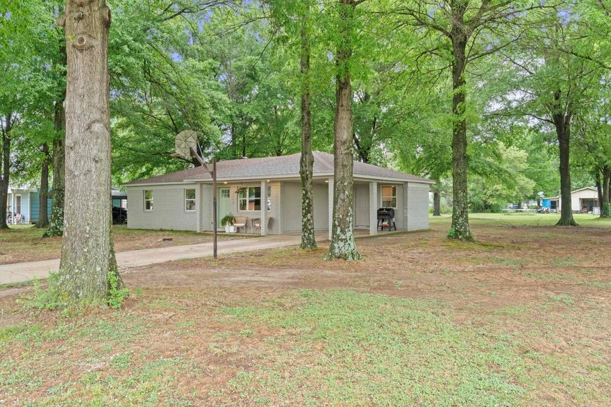 Completely updated and move-in ready! Why rent when you can own this charming 3 bed, 1 bath home situated on a large, tree-shaded corner lot within Wynne city limits in an established neighborhood? This property underwent a full remodel in 2024, including a new roof, windows, kitchen, bathroom, flooring, paint, and fixtures—offering peace of mind and modern style throughout. The living and dining areas flow seamlessly into a beautifully updated kitchen featuring new shaker-style cabinetry, quartz countertops, stainless steel appliances, and a refrigerator that conveys. The bathroom has been completely renovated with a tiled tub surround, updated vanity, and all new fixtures. Additional highlights include new flooring throughout, a spacious laundry room with extra storage, and energy-efficient upgrades that help keep utility costs low. Step outside to enjoy the generous yard space, perfect for relaxing, pets, or entertaining. The property also includes a covered carport and a frame storage building for added convenience. Don’t miss this budget-friendly, low-maintenance home—ideal for first-time buyers, downsizing, or investment potential!