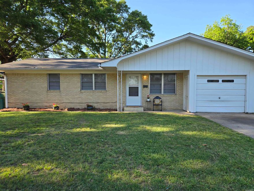 If "Cute as a Button" was a home, 1703 Belmoor Drive in Pine Bluff, Arkansas is it!  This home is the perfect place for any stage of life, starter home, downsize home and more.  Newer floors and updates throughout, large yard with a covered patio.  Move in ready just for you, with appliances included.    Nice neighborhood, close to amenities, easy access to I-530