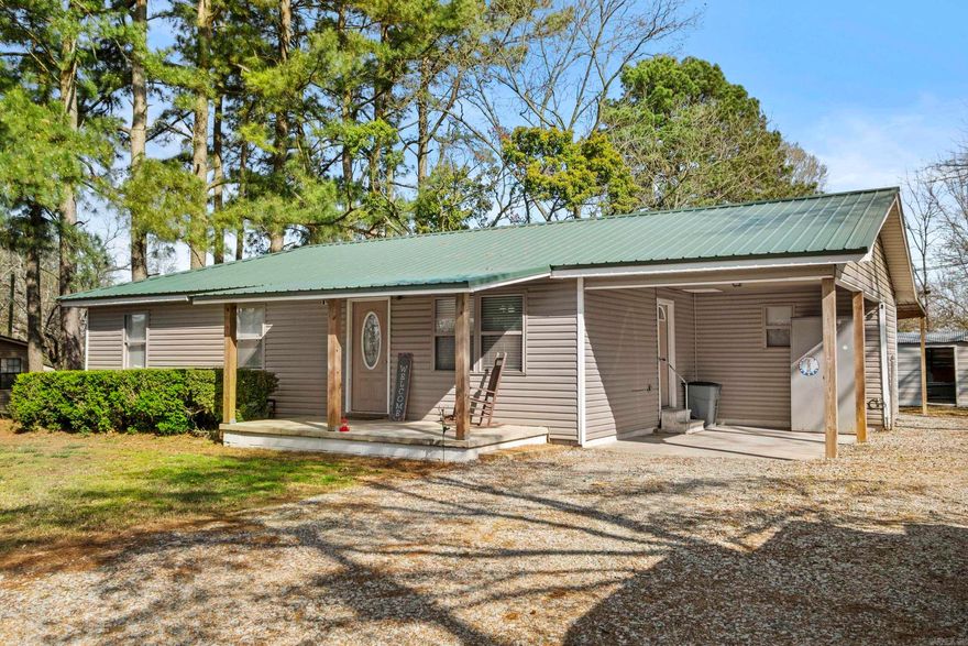 Charming 3-bedroom, 2-bath home located in a quiet, established neighborhood. This home has been updated in recent years and features luxury vinyl plank (LVP) flooring throughout. The metal roof was replaced approximately 2 years ago The open floor plan offers a functional layout, ideal for everyday living and entertaining. Interior includes a bonus storage area. Exterior features a covered patio area, perfect for outdoor gatherings, along with an additional storage building. Property sits on just under half an acre.  Agents are encourage to verfiy sq ft.