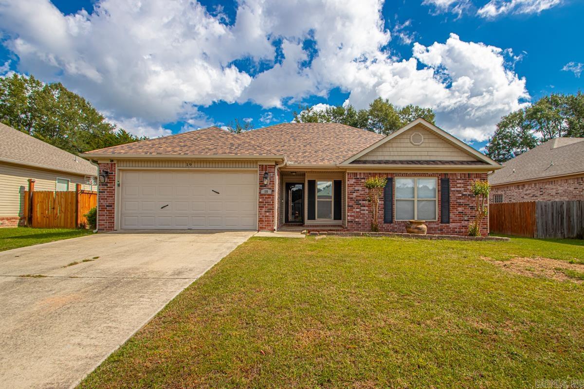 Beautifully updated 3-bedroom, 2-bath home with 1,516 sq. ft. of living space! Enjoy new living room floors (2025), a new roof, HVAC, and primary walk-in shower (2024), plus granite kitchen countertops. Both the living room and primary bedroom feature elegant tray ceilings, adding a touch of charm and style. The heated and cooled garage provides flexibility, and the 14x14 full-electric shop with a garage door in the fully fenced backyard is perfect for projects or storage. With numerous updates throughout, this move-in-ready home is a must-see!