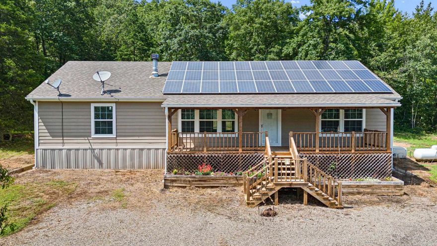 Ever wanted to go off-grid, but the hassle setting up solar & water overwhelm you? Check out this Mountain Beauty 2404 Ross Mountain Rd in Lamar, AR (Pope County)! Where it's already done for you. This secluded homestead is fully equipped with a solar power system, backup generator, a storm cellar, and water well—offering modern comfort with self-sufficiency. The property includes 37.5 acres, a pond stocked with fish, greenhouse, and a detached, heated/cooled shop with its own solar system (Strong enough to run a welder)!  Outdoor lovers will enjoy being within 15 miles of Lake Dardanelle (fishing/boating), the Ozark National Forest (hiking/hunting/ATV trails), & Big Piney Creek / the Illinois Bayou (kayaking/floating). Or, never leave the property with plenty of Deer & other wild game to hunt!  Whether you want a full-time residence or a weekend retreat, this off-grid gem ready to go! For anything that the mountain can't provide, you're within 17 minutes to Dover & 30 minutes to downtown Russellville.