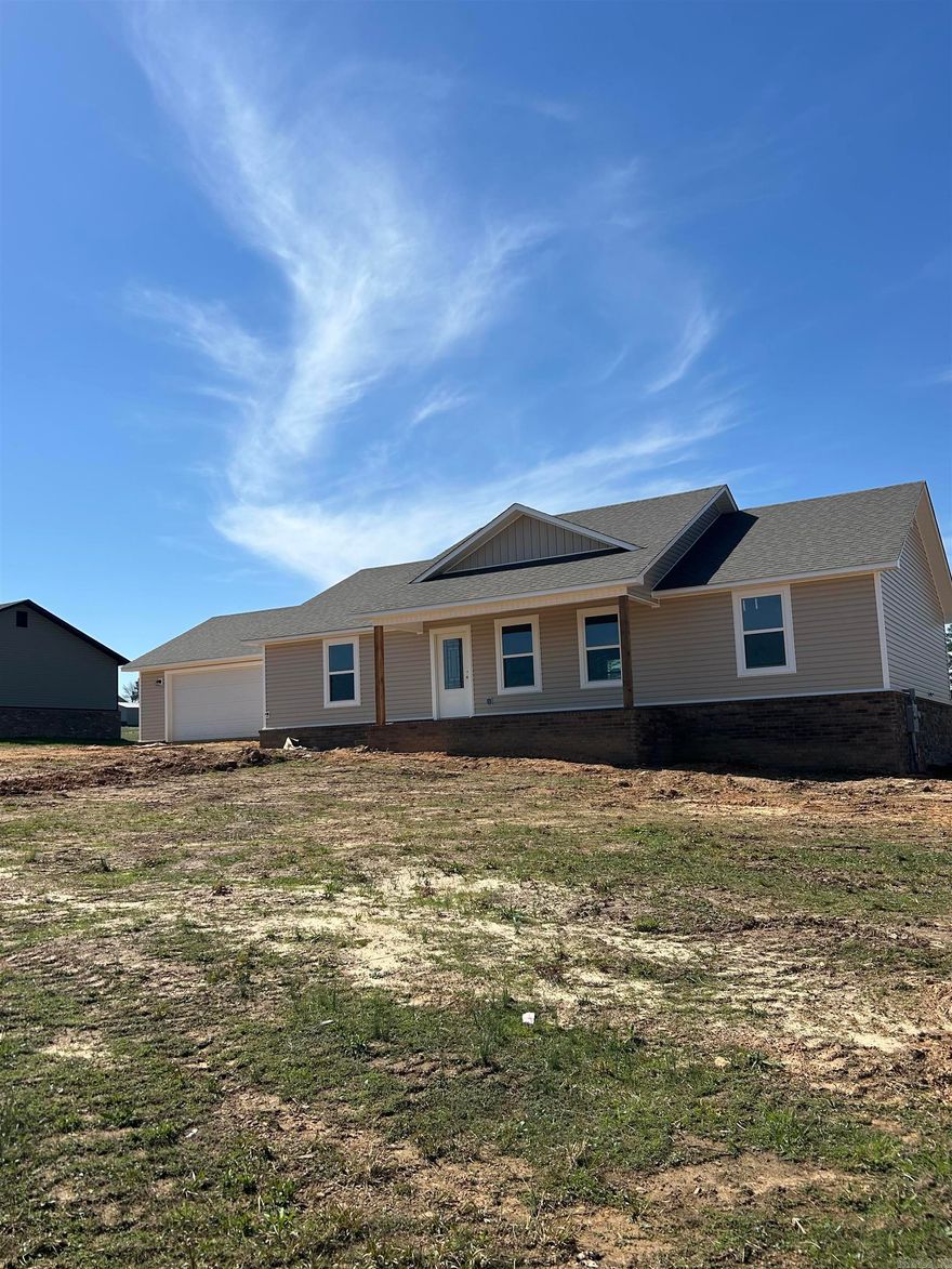 Beautiful new construction home just outside city limits offering 3 bedrooms, 2 full baths, and approximately 1,600 sq ft of thoughtfully designed living space. This home features an open-concept floor plan with a spacious living area that flows seamlessly into the kitchen and dining space—ideal for everyday living and entertaining. The kitchen includes modern cabinetry, solid surface countertops, and ample storage. The private owner’s suite offers a walk-in closet and en-suite bath, while two additional bedrooms provide flexibility for family, guests, or a home office. Enjoy the peace of a quiet setting with convenient access to nearby amenities.