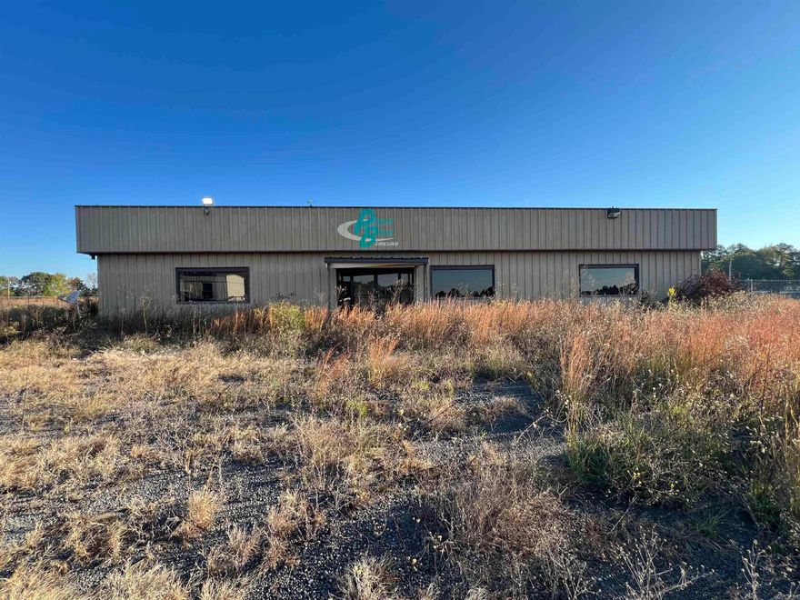 Prime commercial opportunity along busy Highway 65 near Damascus, Arkansas! This 7.16+/- acre commercial property in Faulkner County offers excellent visibility and easy access on one of the region’s most traveled routes. The site includes three well-maintained buildings totaling over 9,000+/- square feet — ideal for a wide variety of business uses. The main building features 5,000+/- sq ft of showroom and office space, perfect for customer-facing operations or administrative needs. A 3,040+/- sq ft shop building provides ample room for equipment storage, repairs, or light manufacturing. An additional 1,000+/- sq ft office adds flexibility for expansion or separate business operations. Fully fenced and gated, the property offers security and organization for vehicles, materials, or inventory. With its generous lot size, level terrain, and prime highway frontage, this location is well-suited for an RV or boat dealership, mobile home sales center, or a small manufacturing or service facility. Whether you’re expanding an existing business or launching a new venture, this property combines excellent location, space, and functionality — all in one strategic package.