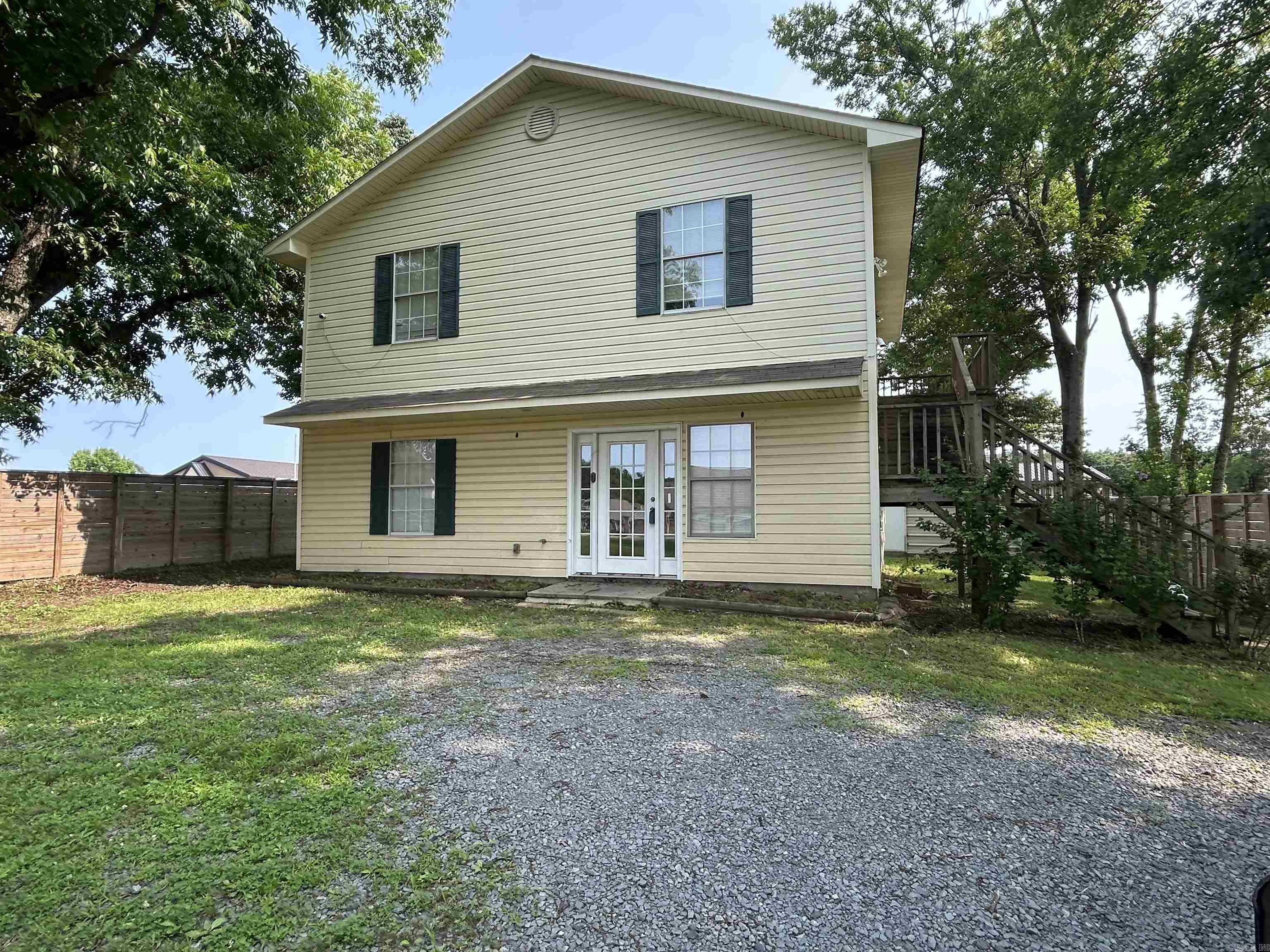 This two-story home is ready for a new owner. Lower level offers living room, kitchen, dining area, 1/2 bath off living room, pantry and main bedroom with a full bath. Upstairs offers a bonus room area, 2 bedrooms, full bath, laundry room and deck off bonus room. Bedrooms have carpet, main living area downstairs has laminate flooring. Metal storage building in back yard will convey. Home is located next door to elementary & middle school and walking distance to UCA. Sellers offering 12 month home warranty up to $800.00