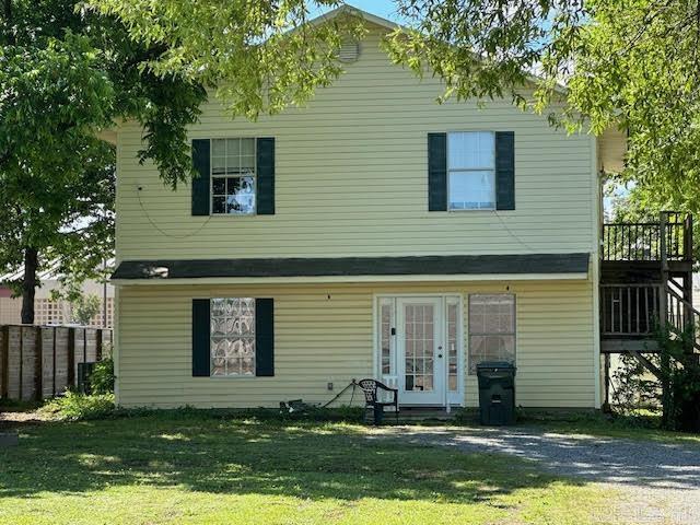 This two-story home is ready for a new owner. Lower level offers living room, kitchen, dining area, 1/2 bath off living room, pantry and main bedroom with a full bath. Upstairs offers a bonus room area, 2 bedrooms, full bath, laundry room and deck off bonus room. Bedrooms have carpet, main living area downstairs has laminate flooring. Metal storage building in back yard will convey. Home is located next door to elementary & middle school and walking distance to UCA. Home is being sold "AS IS".