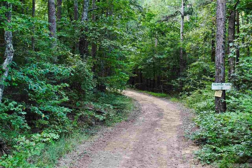 Formerly a Doctors private retreat, this property is stunning. Driving down the county road that ends at the property you will want to stop at the private swimming hole on Big Creek that is situated at the gated entrance. The property is fenced and cross fenced with several gates leading to several improved pastures. 2800 square feet two story home, 2nd Home is 884sqft 2Bedroom/1.5Bath with kitchenette and living quarters, 12X34 equipment shed and a 20X50 metal pole barn. Wildlife is abundant and there are two year round creeks.