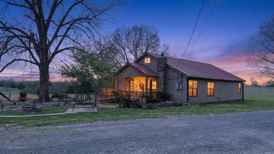 Welcome to your own cowboy paradise! Nestled on 1.02 peaceful acres, this charming 2-bedroom, 1-bath homestead with an upstairs loft is full of warmth, character, and country charm. From the inviting front porch to the cozy, rustic interior, this home feels like a retreat from the moment you arrive.   Designed for those dreaming of the homestead lifestyle, the property features a well-equipped barn with built-in feed bins, stalls for large animals, a baby chick brooding pen, 3 chicken houses, and 2 pig or goat pens. The barn also offers lights, outlets, abundant storage for tools and equipment, plus a drive-through lane for tractors and 4-wheelers. A cellar adds even more functionality and country appeal.