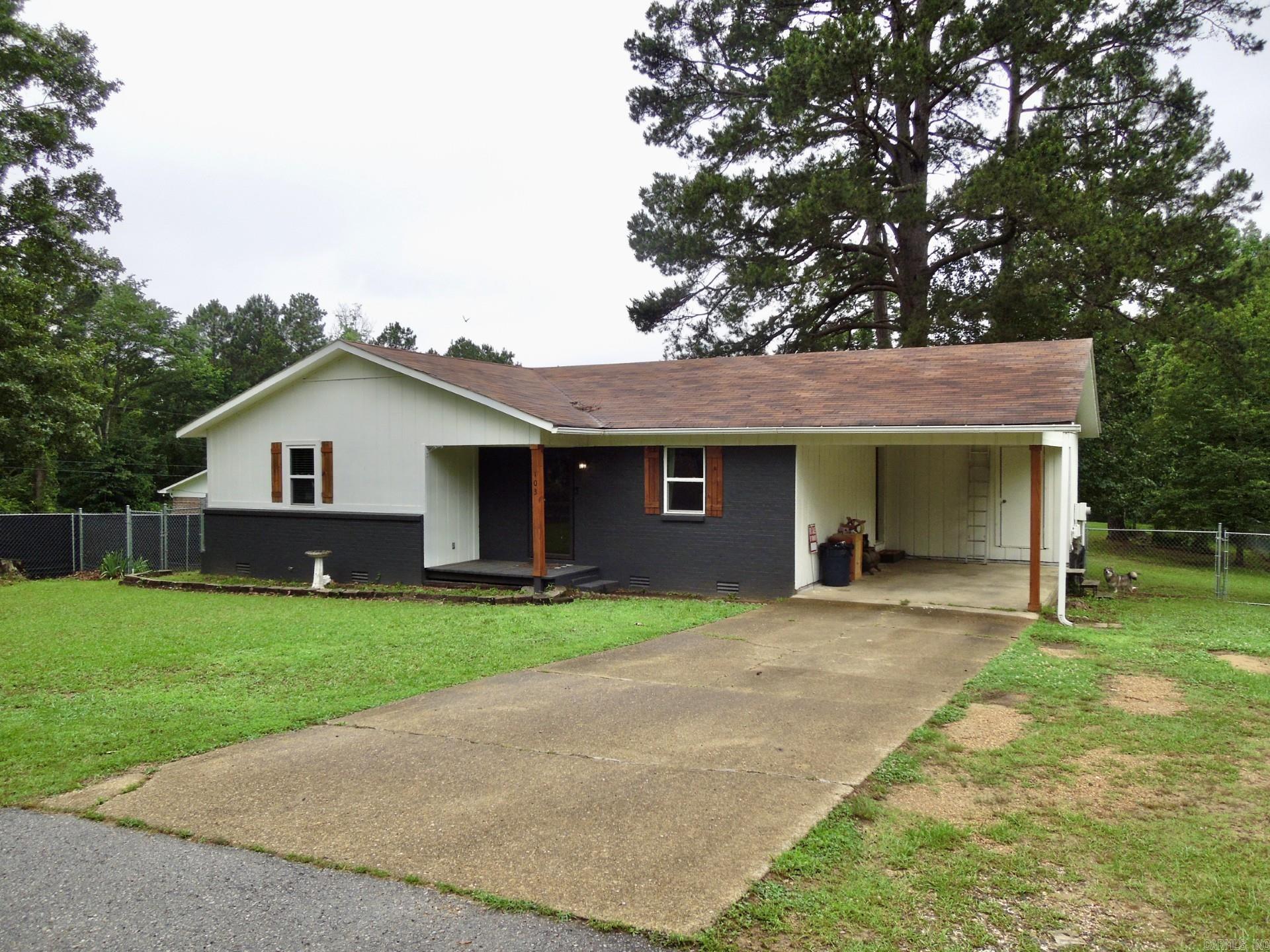 Welcome to 103 Liberty Lane, a charming 3-bedroom home with modern updates and a spacious backyard. Only located 10 minutes from Lake Degray and the OBU/HSU campus. This 3-bedroom, 1.5-bath home sits on 0.4 acres, offering a beautifully updated exterior, a spacious fenced-in backyard, and an inviting open interior. In the kitchen, you can find convenience with a kitchen island that provides ample space for meal prep and casual dining. The open concept of the home gives the house a welcoming flow through the living area. Dedicated laundry room offers extra storage and functionality. Bathrooms have been newly updated. The generous rooms were made for comfort. Major upgrades ensure peace of mind, including new exterior paint and siding (2024), updated windows (2022), a water heater (2021), and a new roof (2019). Make your way out back to the large fenced-in yard to find an enjoyable back deck. The carport also provides your vehicle with protection from the elements. Do not miss your chance to make 103 Liberty Lane your very own! Schedule a private tour today!