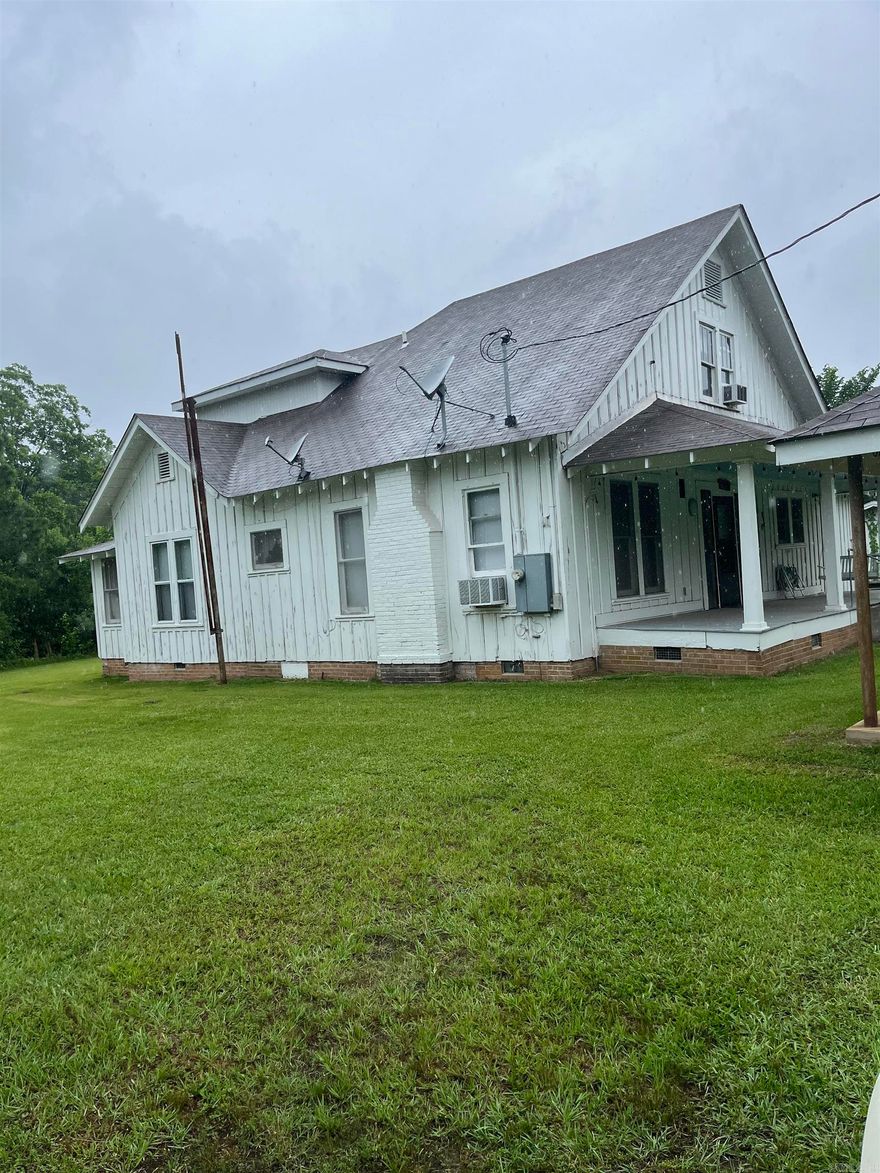 Charming Victorian era home with second story added around 1965. Home is well cared for but needs restoration to return it to it's original beauty. Rooms are large. Property is at the end of a blacktop road and is secluded by being set back from the road.  It is unknown if hand pump well is functional. Would make a lovely venue for family reunions or weddings. Home sits on 21.10 acres per an older appraisal. Some fencing exits. Pond was hand dug.
