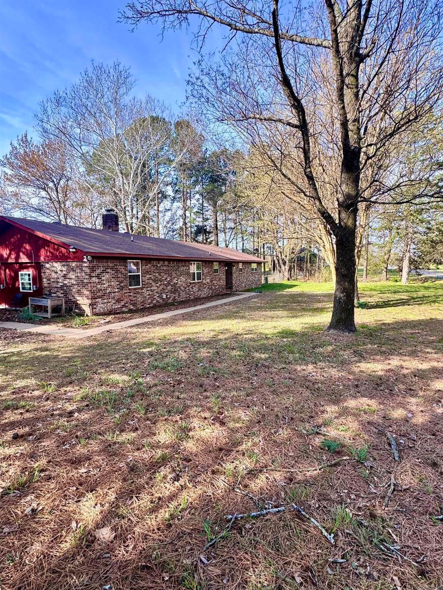 Charming and spacious, this 5-bedroom, 2-bath home in the desirable Leisure Estates addition offers 1,670 square feet of comfortable living. Enjoy cozy evenings by the fireplace and take advantage of the large front and fully fenced backyard—perfect for entertaining, pets, or play. With plenty of room to grow and a $2,000 flooring allowance offered by the seller, this home is full of potential and ready for your personal touch!