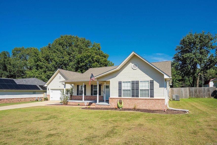 Beautifully updated 3-bedroom, 2-bathroom gem in the heart of Cabot! Step inside to discover vaulted ceilings in the spacious living room, creating an open and airy feel perfect for relaxing or entertaining. Enjoy peace of mind with a brand-new roof and HVAC, plus thoughtful upgrades throughout the home. The large front porch offers a warm welcome and plenty of space to unwind, while the fully fenced backyard is ideal for kids, pets, or gatherings with friends. Picture evenings on the concrete patio, ready for string lights and outdoor fun, all overlooking a big, beautiful yard. Don’t miss your chance to own a move-in ready home with modern comforts and charming details. ***FLOORING IN LIVING ROOM/DINING ROOM/HALLWAY TO BE REPLACED BY 10/19. INTERIOR PHOTOS ON 10/11*** AGENTS SEE REMARKS.