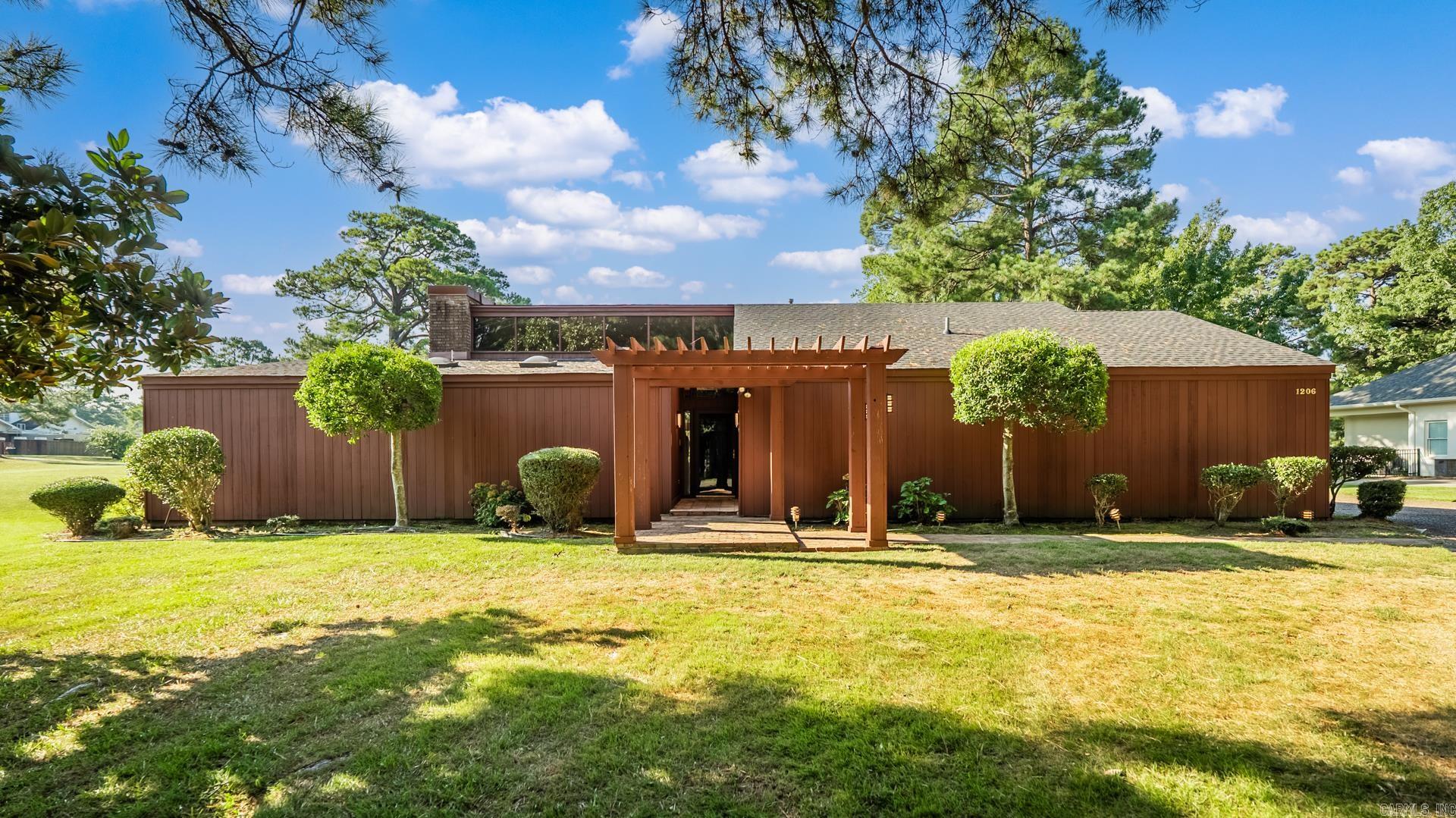 Welcome to 1206 W 46th, a beautifully updated home perfectly situated on the 18th hole of the Pine Bluff Country Club. Enjoy country club living right from your backyard, with sweeping golf course views and easy access to all the amenities. This property offers unbeatable convenience just two minutes from Jefferson Regional Medical Center, shopping, and dining. Step inside to find modern upgrades throughout, blending comfort and style with fresh finishes that make this home move-in ready with generous storage space! Whether you are hosting friends, relaxing with family, or taking in the serene golf course setting, this home delivers the perfect combination of location, lifestyle, and charm. Take advantage of this rare opportunity to own a home designed by Pine Bluff's E. Fay Jones.
