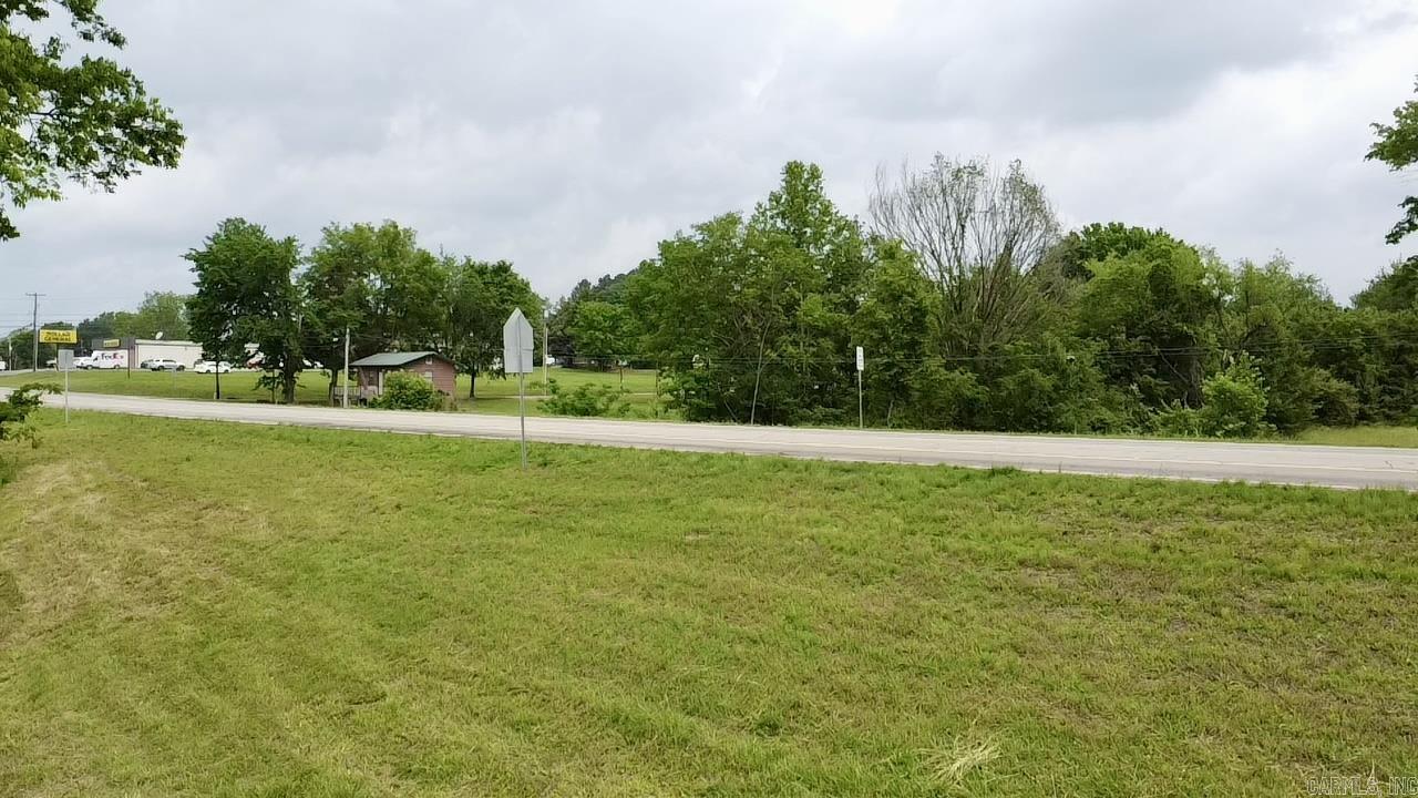 Highly visible commercial corner lot with over 362 feet of frontage on US Hwy 64 in Lamar, AR. Ideally situated near Dollar General, a fuel station, and local restaurants, and just minutes from Interstate 40. The property includes a recent survey, with all utilities available on-site or adjacent. The owner has begun strategic filling to raise the elevation and enhance property value. A drainage pipe is already in place to divert water from the site. This prime location offers excellent potential for a variety of business types.