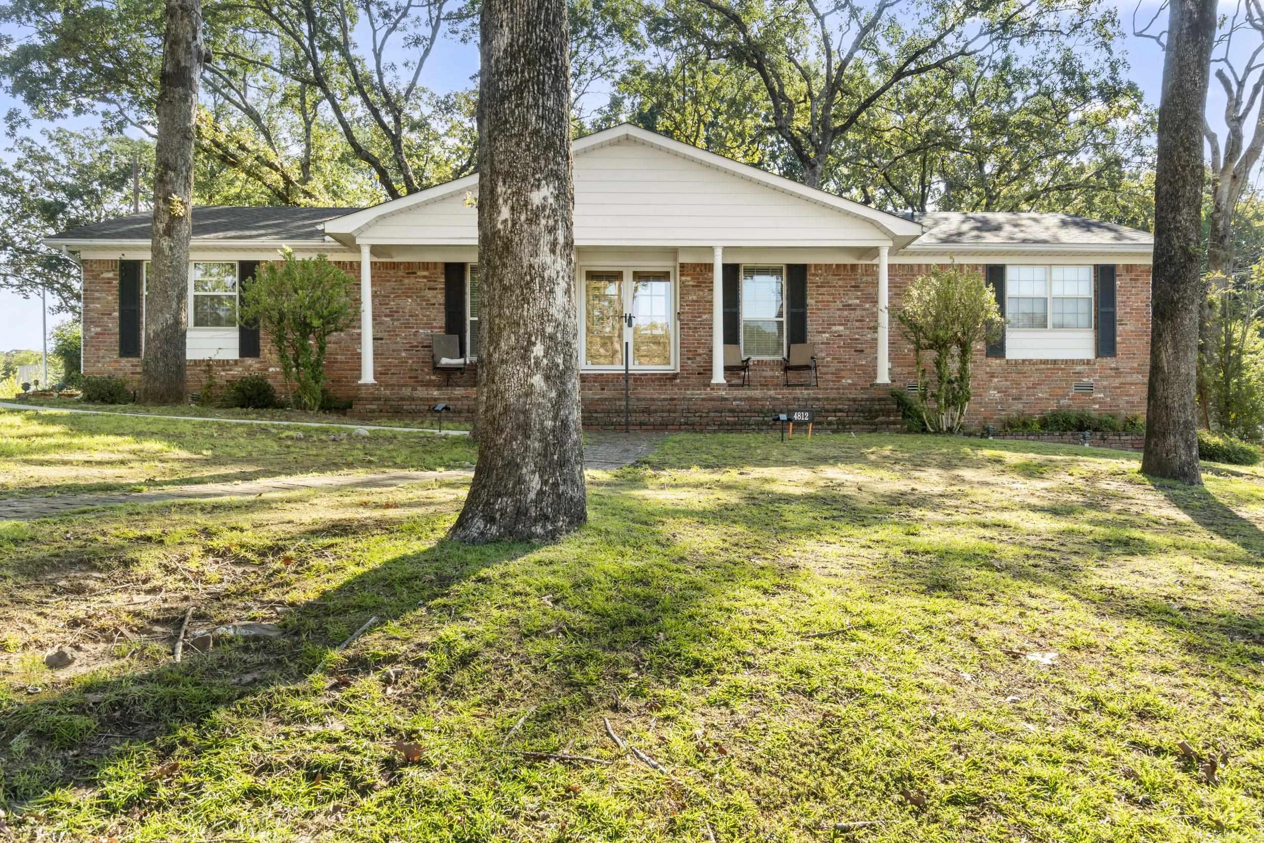 Step into this fully renovated 3-bed, 2-bath home where modern design meets everyday comfort. The open layout flows seamlessly from gleaming original hardwood floors to the high-end marble tile that defines the spacious kitchen and dining areas with an extra bar top, desk or mail station built in for convenience. The kitchen is a showstopper with all-new appliances (including a double oven with built-in air fryer!), endless countertop space, and fresh white cabinetry. Oversized windows flood the home with natural light, while a cozy fireplace and sunroom retreat add charm and warmth. Enjoy a spacious corner lot in a highly walkable neighborhood—just minutes from downtown Little Rock and such easy freeway access for any fast commute. A 2-car garage, updated bathrooms, and modern lighting throughout complete the move-in ready package.