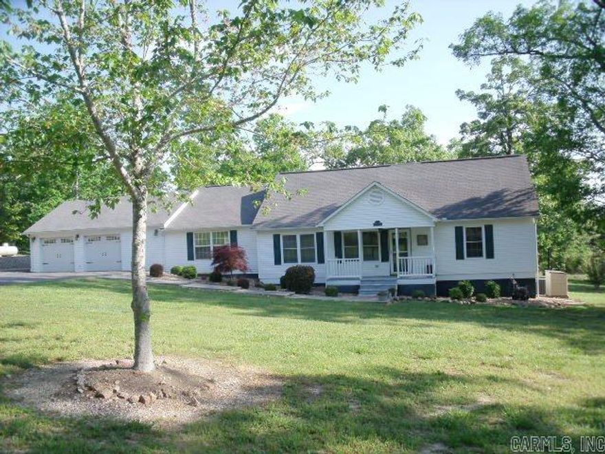 Beautiful updated home in private country setting on 4.36 ac with a spring fed pond and detached heated shop with self contained guest quarters with laundry.