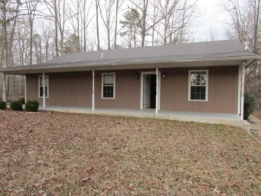 This country home sits on 5 acres in Hensley.  This 3 bedroom 2 bath home has an updated kitchen and baths.  Kitchen has lots of cabinets and an island.  Crown molding throughout.  Master bathroom has a jetted tub.   Backyard is fenced, 2 storage buildings.  Deck off the back of the home.  This home is sold "AS IS".  Agents see Remarks**