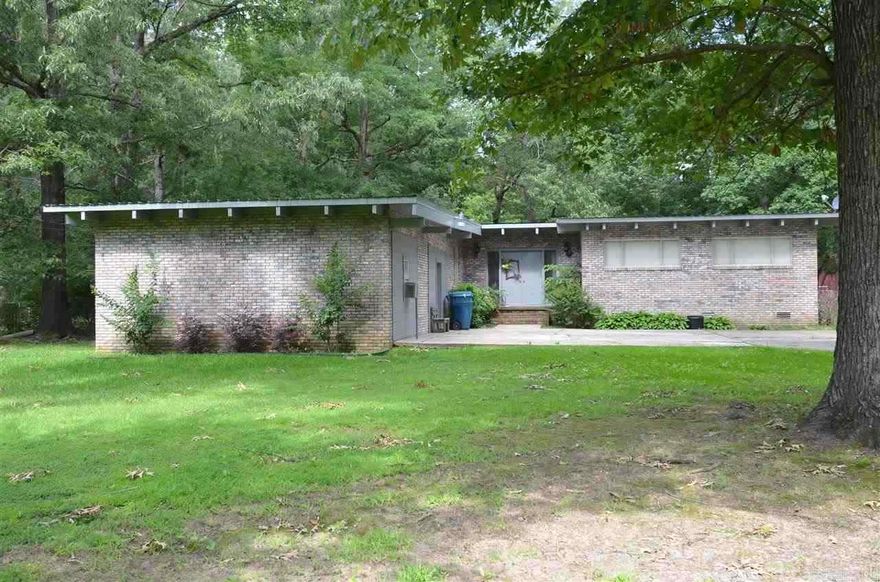 Country living in the city.  This home has 3 bedrooms on the main level, gas fireplace, open kitchen area, cozy den, covered patio, two bedrooms on the lower level, a 20x30 workshop with a wood burning stove, all on .75 acres. This qualifies for Regions Bank 100% in house financing product regardless of your buyer's income qualifications.