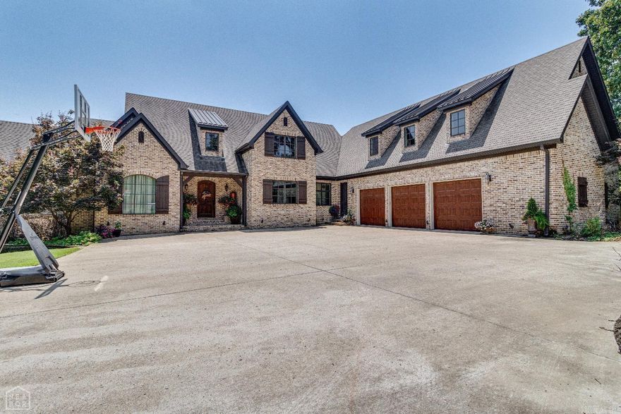 This gorgeous home has finally come on the market! Nestled in a highly sought cul de sac, It offers location, space, amenities, and privacy all in one amazing property. Sitting on over 2 acres, in Valley View school dist, This luxury custom home has elegance, beauty, and curb appeal. From the intricate ornate woodwork, to the hardwood flooring, to the large windows that let the natural light flow, This home makes the WOW impression when you step inside! Very large family space with fireplace and the kitchen that is a chefs dream, immediately greet you as you enter. The Kitchen has 2 large islands, breakfast bar, Stainless appliances, separate dining area, custom cabinetry with lots of cabinet and countertop space. The Master suite has 2 walk in closets. Get ready for the day in style because one of the closets is a room in itself! It's a must see!! This home has oversized bedrooms and bonus areas that gives even the largest families all the space they could ever need. The huge walkout basement has a fully loaded kitchen, massive living areas, tall ceilings, and large windows that look out over the yard and wooded acreage behind the home. From gaming areas to a home gym, to additi