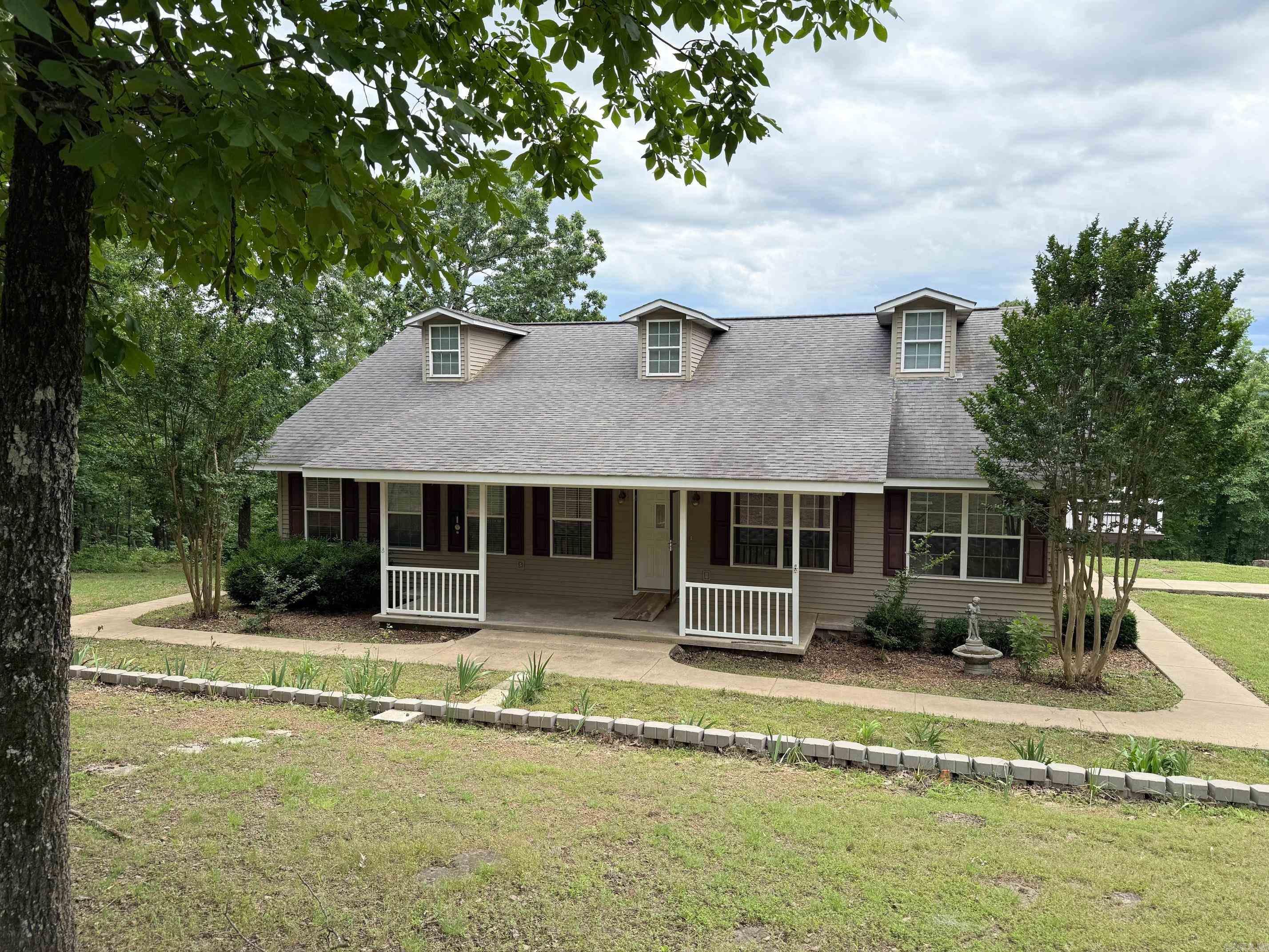 Country Living at its BEST!! The serene country home located on 16.52 acres in beautiful Shirley!! This home features 5 bedrooms and 2 bath with a loft space. Oversized master ensuite! Site built wood burning fireplace. Spacious living room and kitchen area perfect for entertaining. Closet Space GALORE! Two carports and two storage buildings. Just minutes from Greers Ferry Lake. New AC and Heat installed last year. Fresh paint throughout. Options are limitless here!!! Amazing view of the valley behind the home!!
