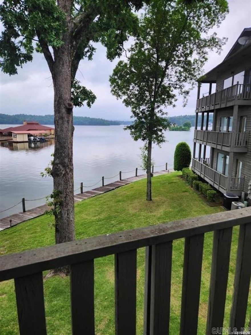 What a view!! Two same level condos sold together with the ability to renovate into single dwelling. Located directly on Lake Hamilton, Boat Slip included!!!!!!   Closed Piers foundation  Fiberglass Shingles POA Dues include a termite contract