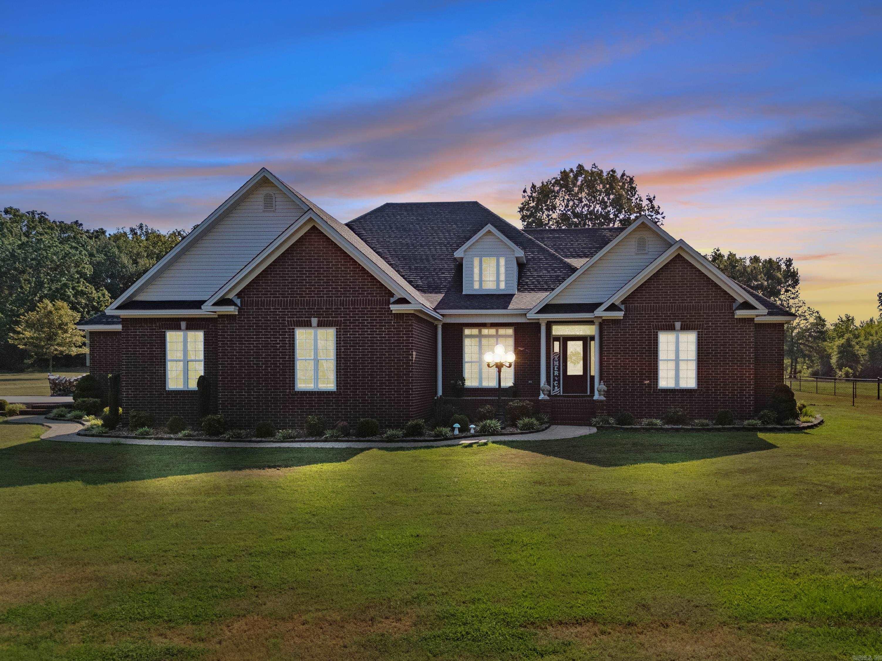 Immaculate 3br/2ba custom home on 9.48 acres! Split floor plan with a large master suite, big walk in closet, tray ceilings, walk-in shower, and gas log fireplace. Gourmet kitchen features granite countertops, island, pull-outs, pantry, breakfast bar and formal dining Very large 1,069 sq ft garage attached to the house . RECENT UPGRADES IN 2024: whole-house generator, fireplace insert, Slide in Electric Range with Convection oven and Induction cook top, black chain link fence, and new 9'4"x20' sunroom with Glass windows and door with attached screens. Built with 6" walls, double tray ceiling in living, WIDE doorways, plantation style blinds, & neutral finishes. HVAC w/heat pump & Roof replaced in 2017. Exterior includes a 40x48 insulated red iron shop with 16' ceilings, 12x14 doors, electric, water and septic. Storm Shelter, 500gal leased propane tank for generator, 125gal owned propane tank for fireplace, pond at back of the property, and so much more!! Truly a remarkable, move-in ready home with quality all throughout!! All of this at an amazing price!